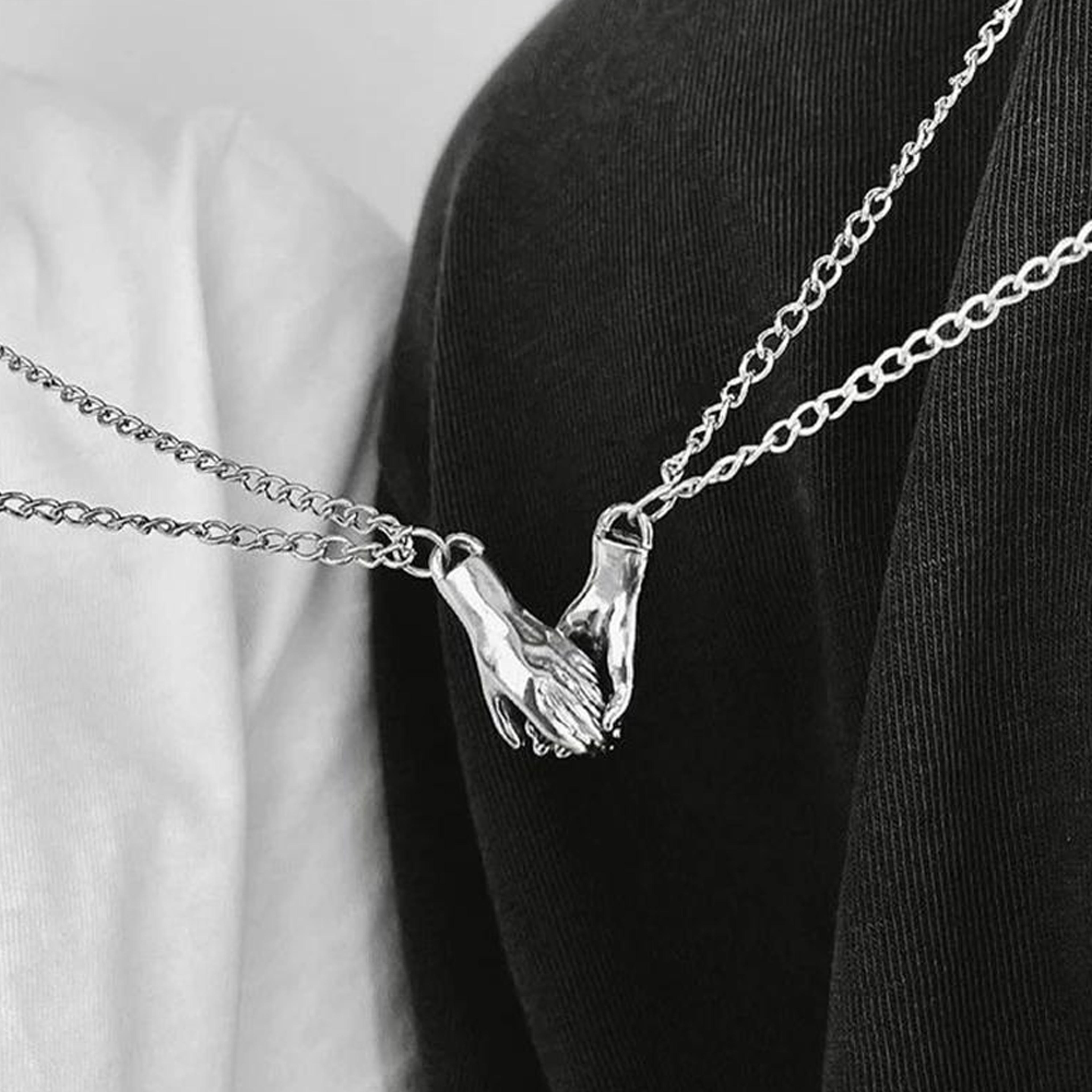 holdhandscouplenecklace2.png