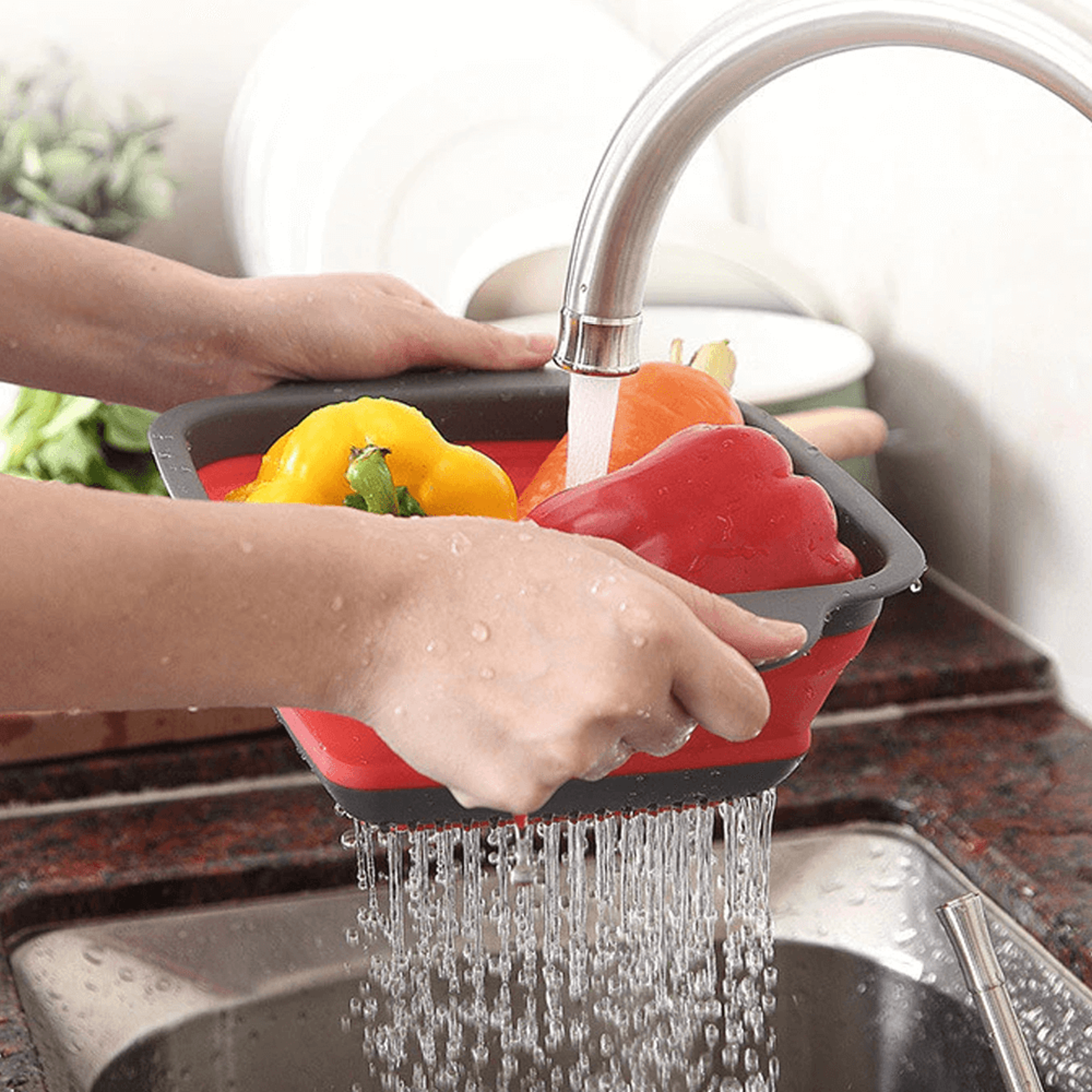 siliconefoldinganddrainingbasketmakeswashingfruitsandvegetableseasyred.png
