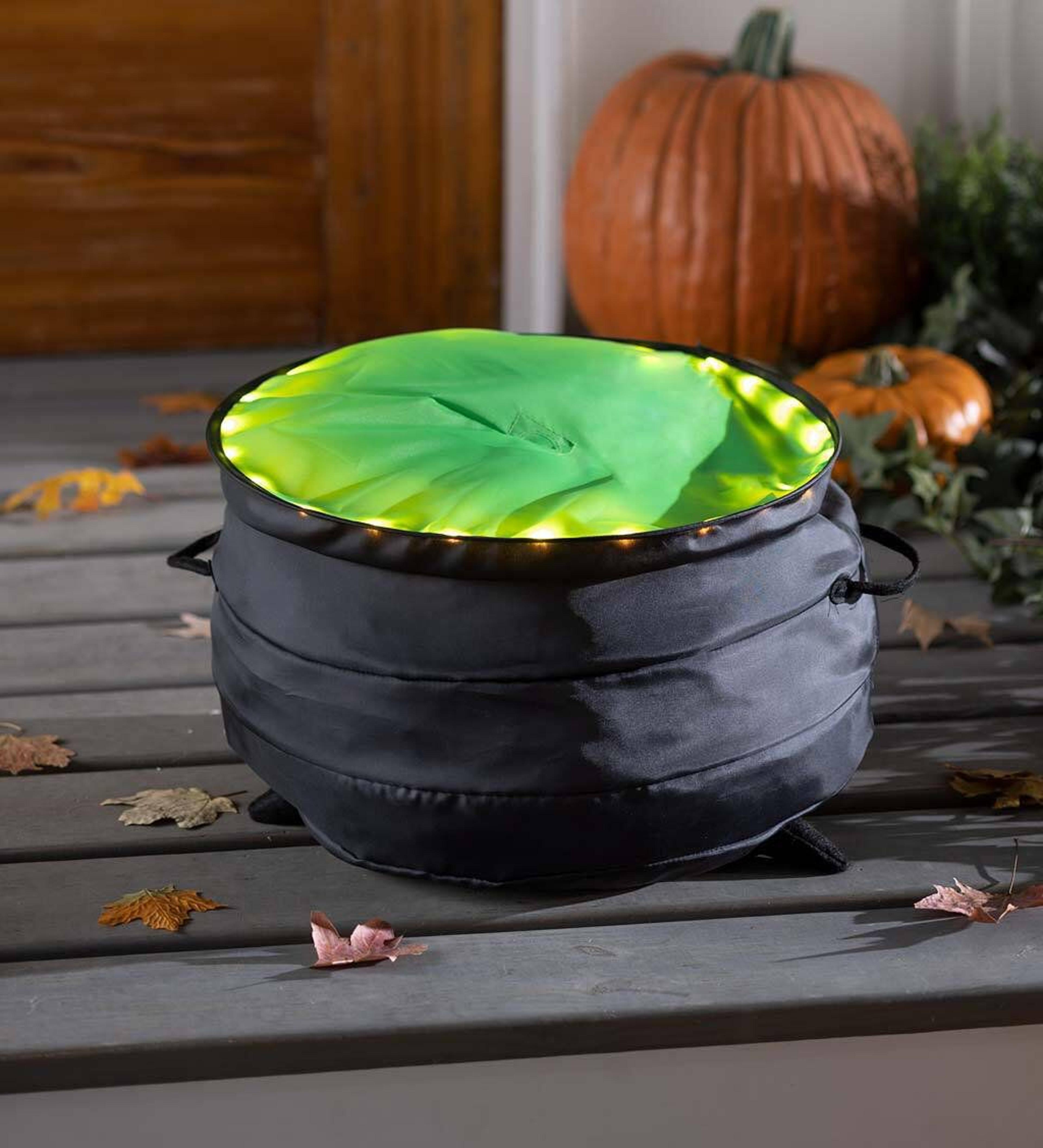 freestanding halloween witch decoration with green light for outdoor display