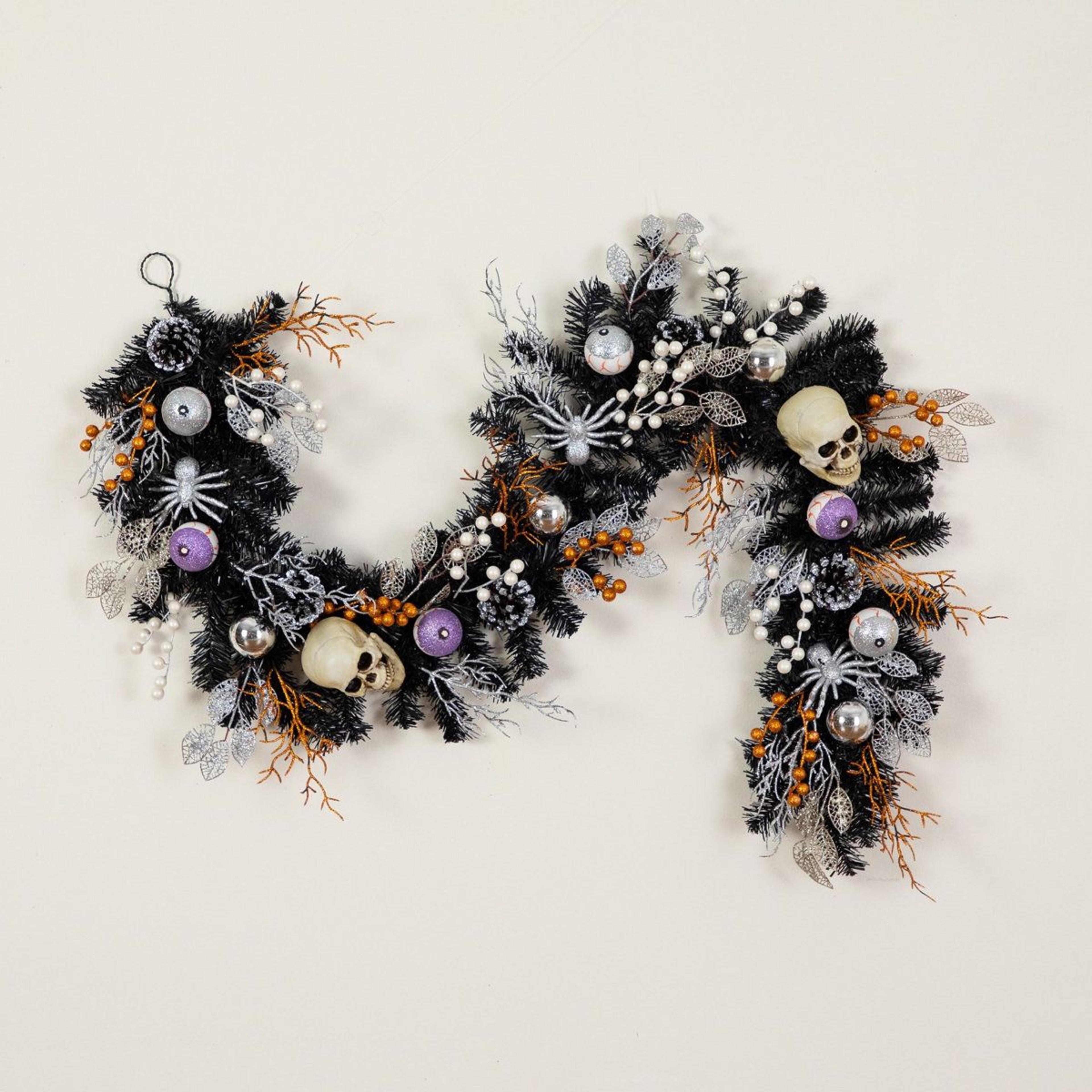 black halloween garland with skulls eyeballs and spiders