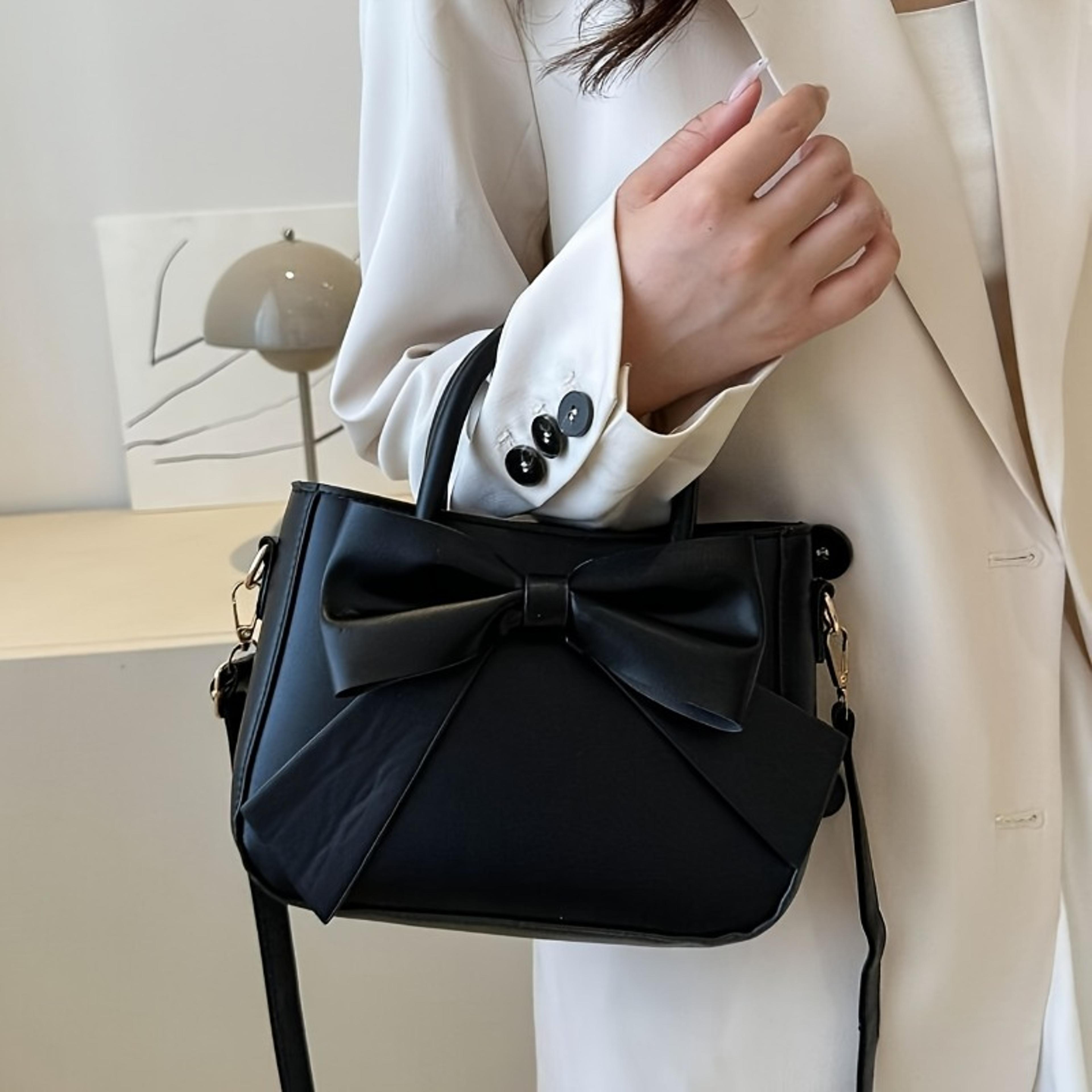 stylish daily shoulder crossbody bag with golden hardware and elegant black bow