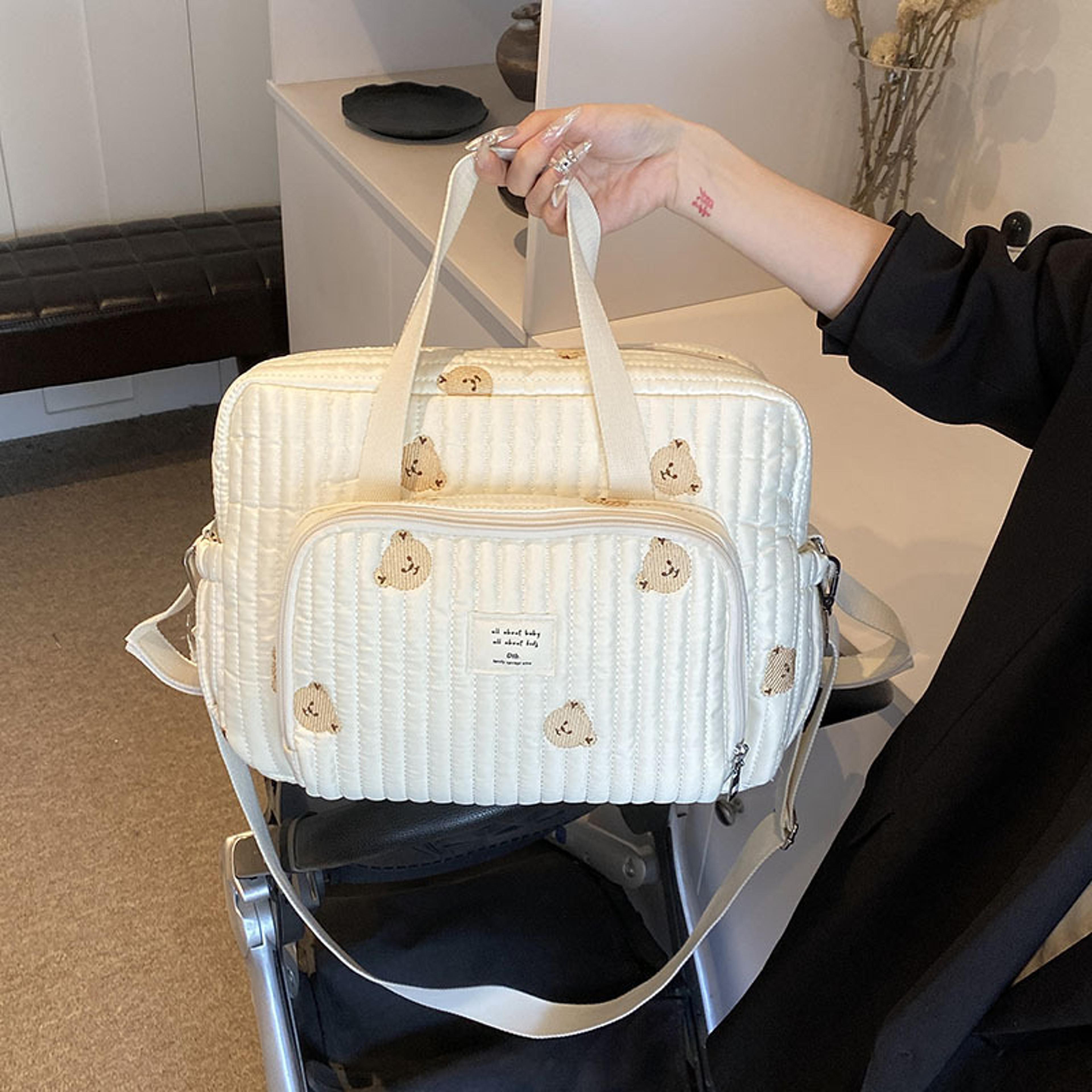 large maternity diaper bag with embroidered design, perfect for travel, hospital & everyday use