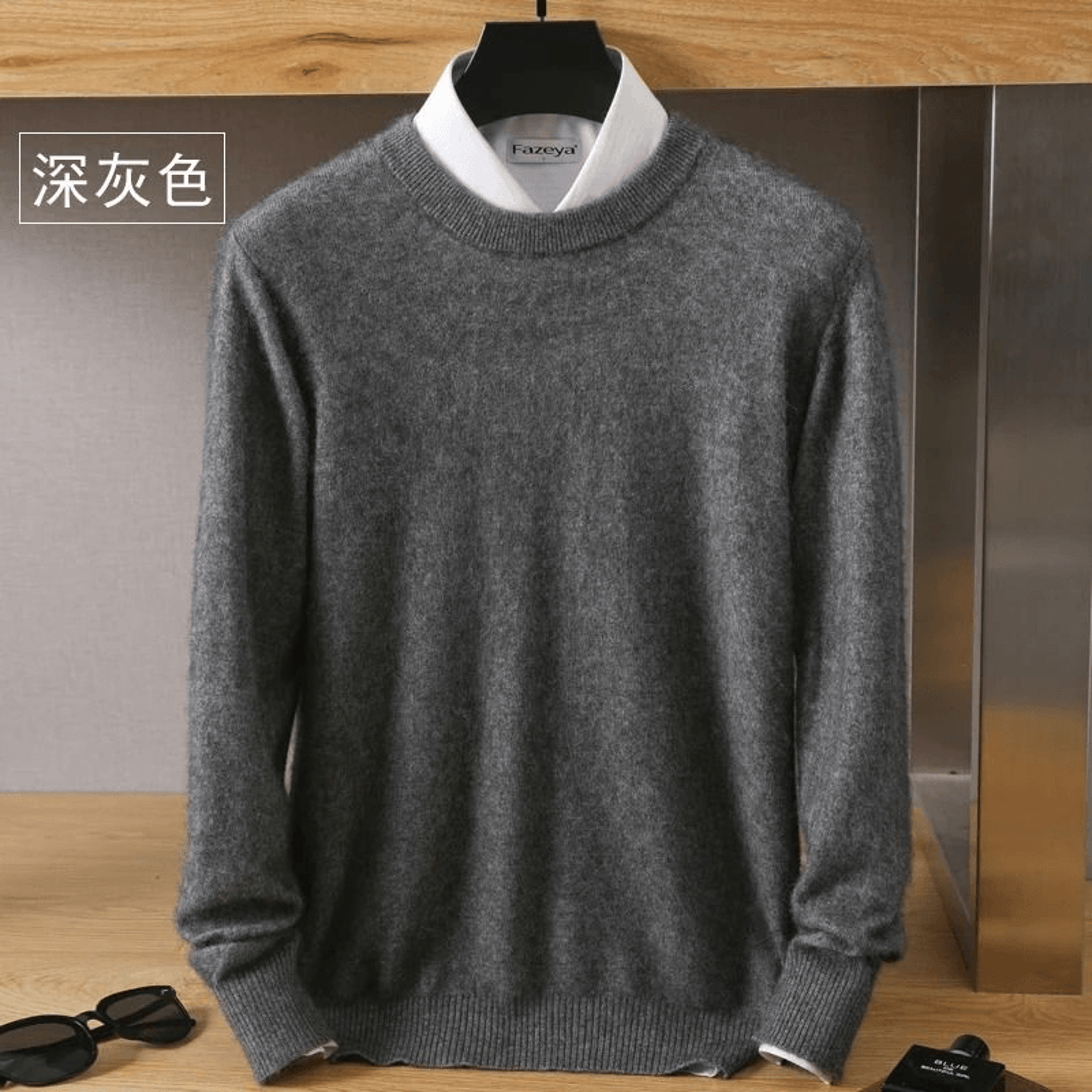 flatlay of folded knit sweater with gift tag