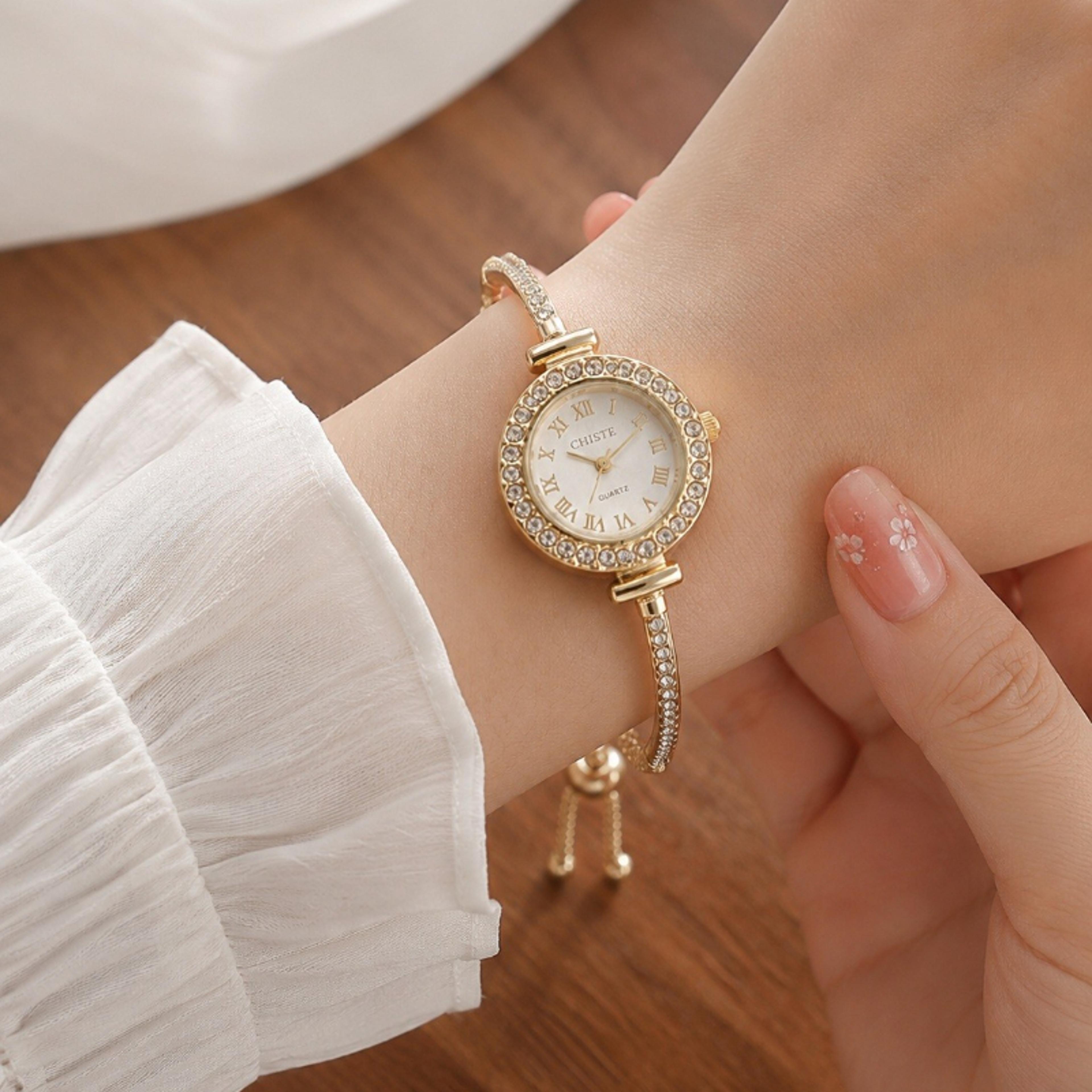 women's rhinestone quartz watch with slim gold bracelet and roman numeral dial