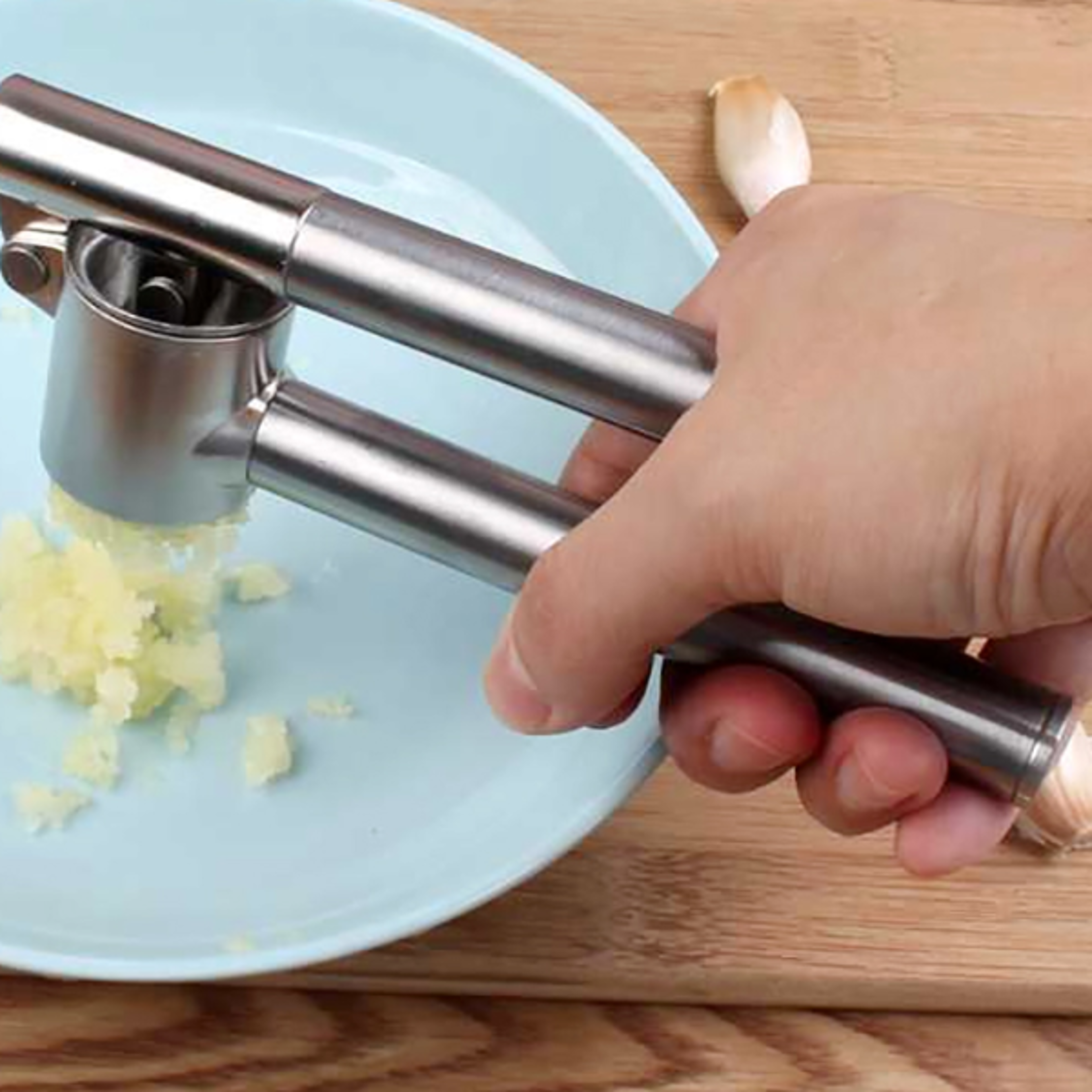 hand-pressed stainless steel garlic press, ginger artifact, potato masher