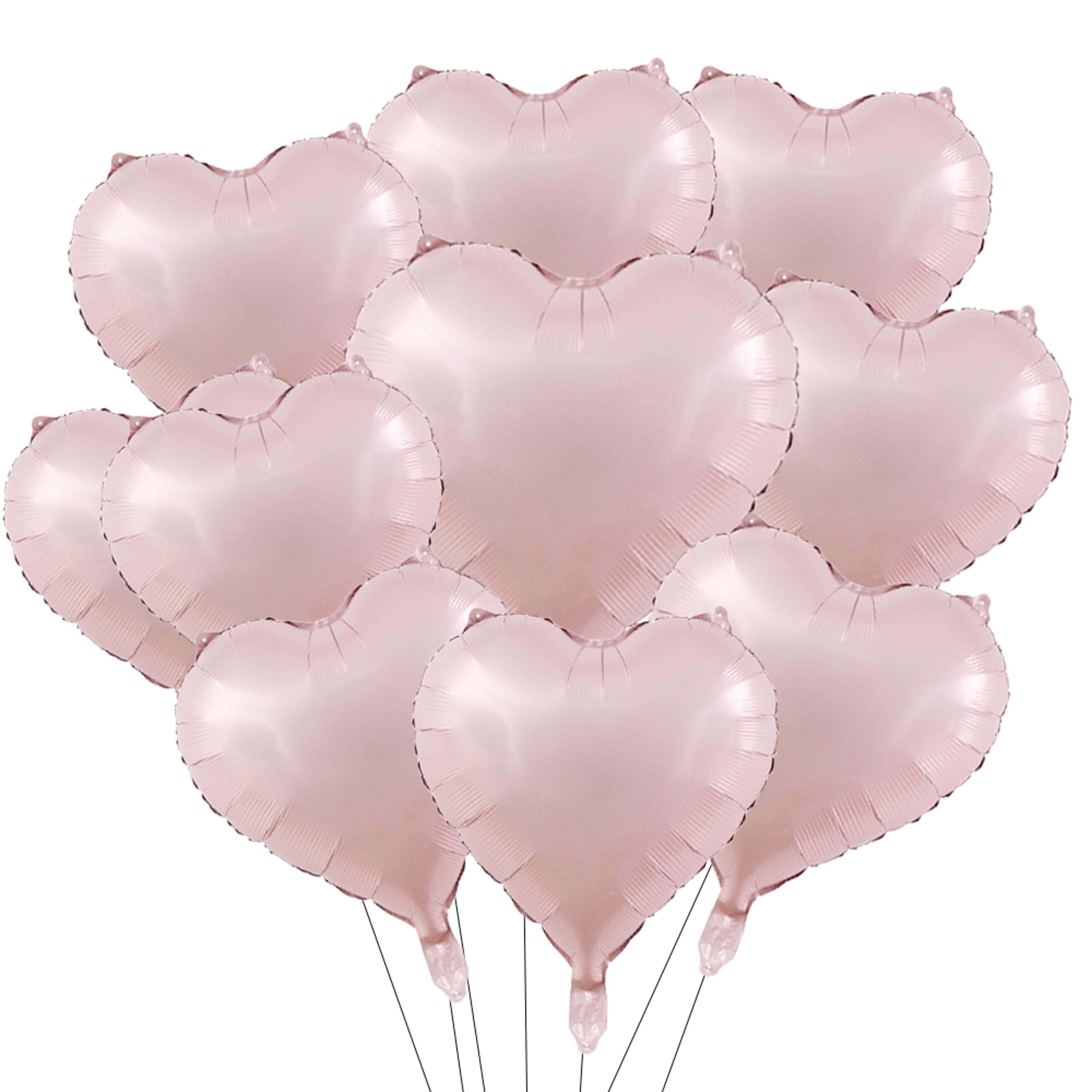 heart foil balloons in pink and sage green for party decorations