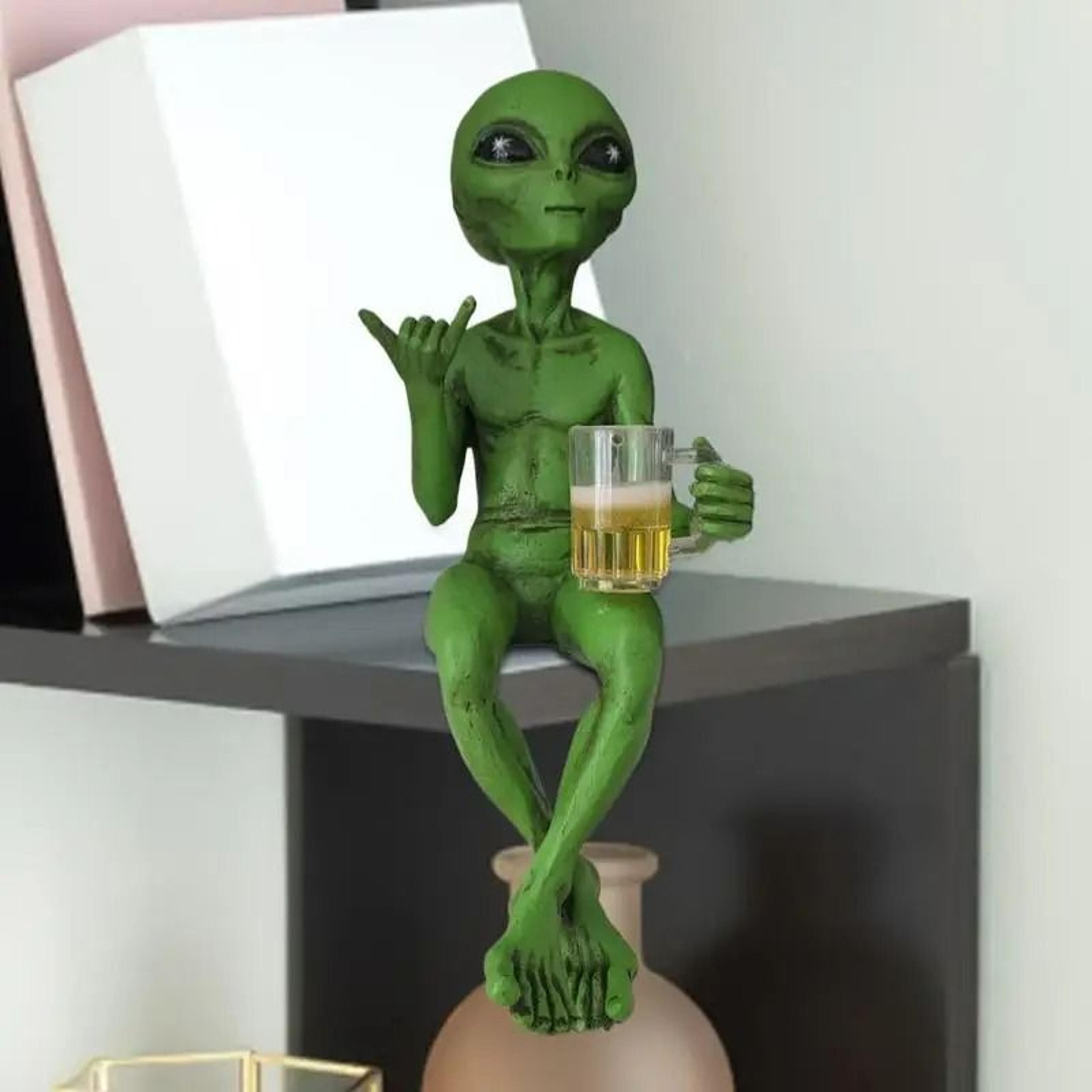 beer drinking alien statue