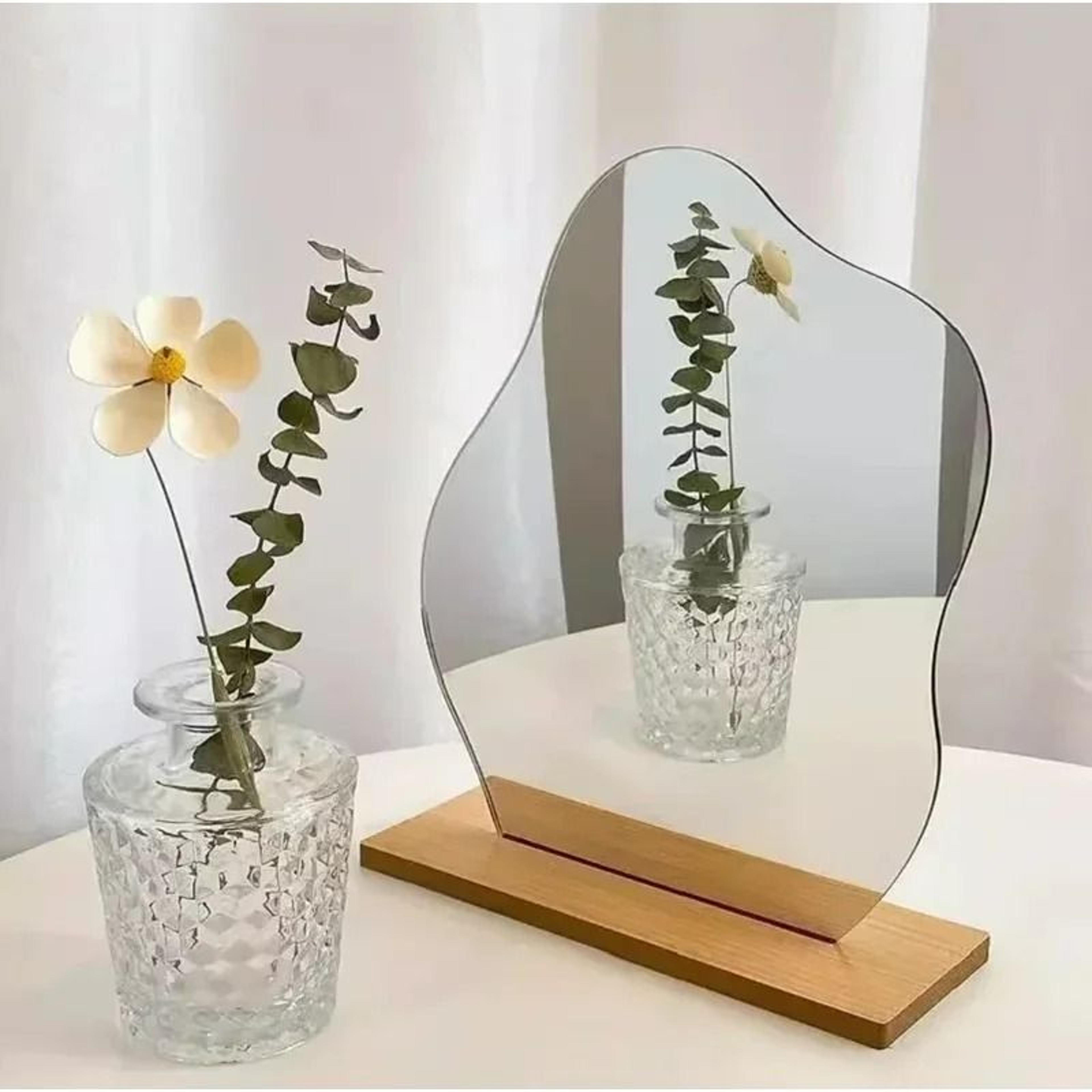 minimalist irregular acrylic vanity mirror with wooden base