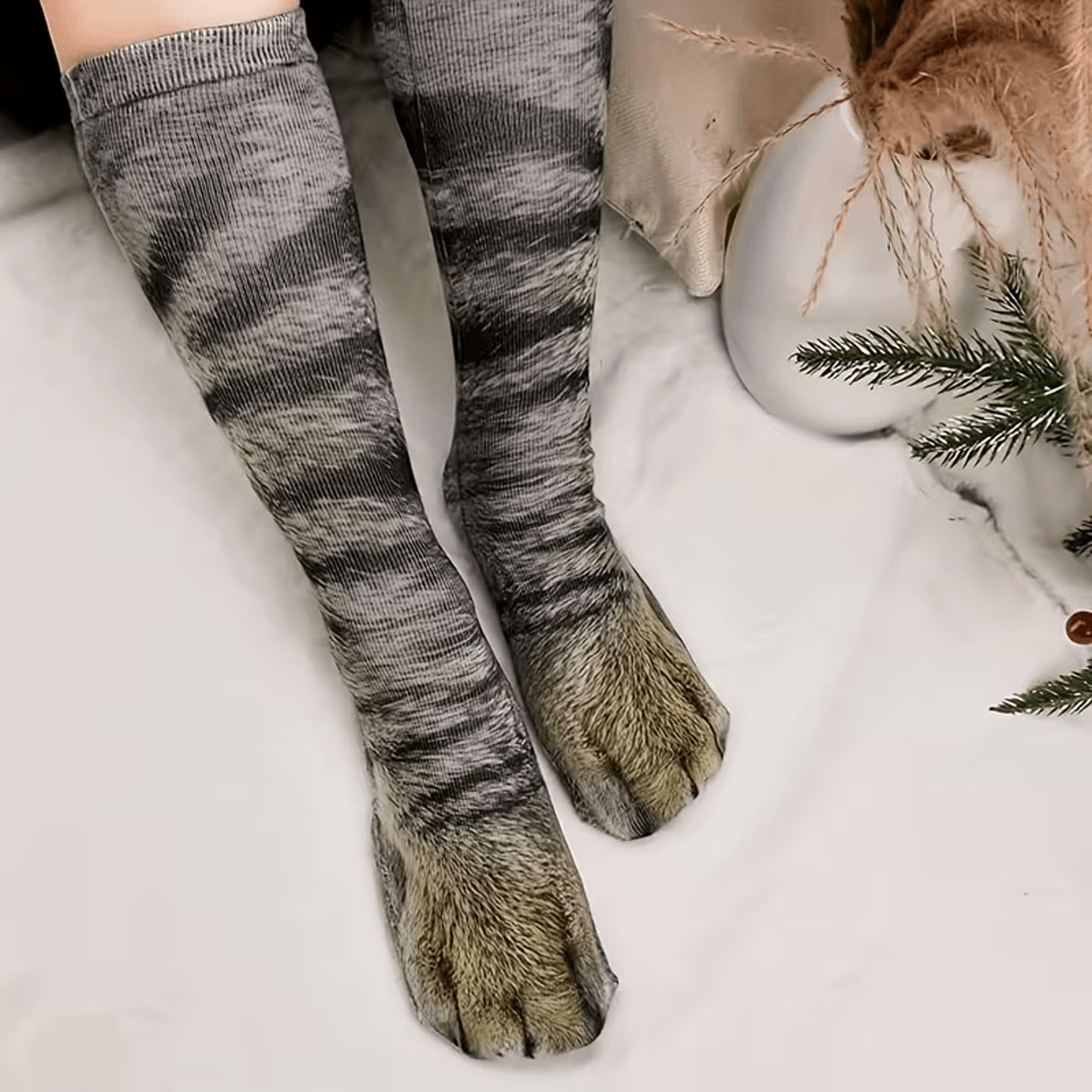Realistic dog paw socks worn by adult