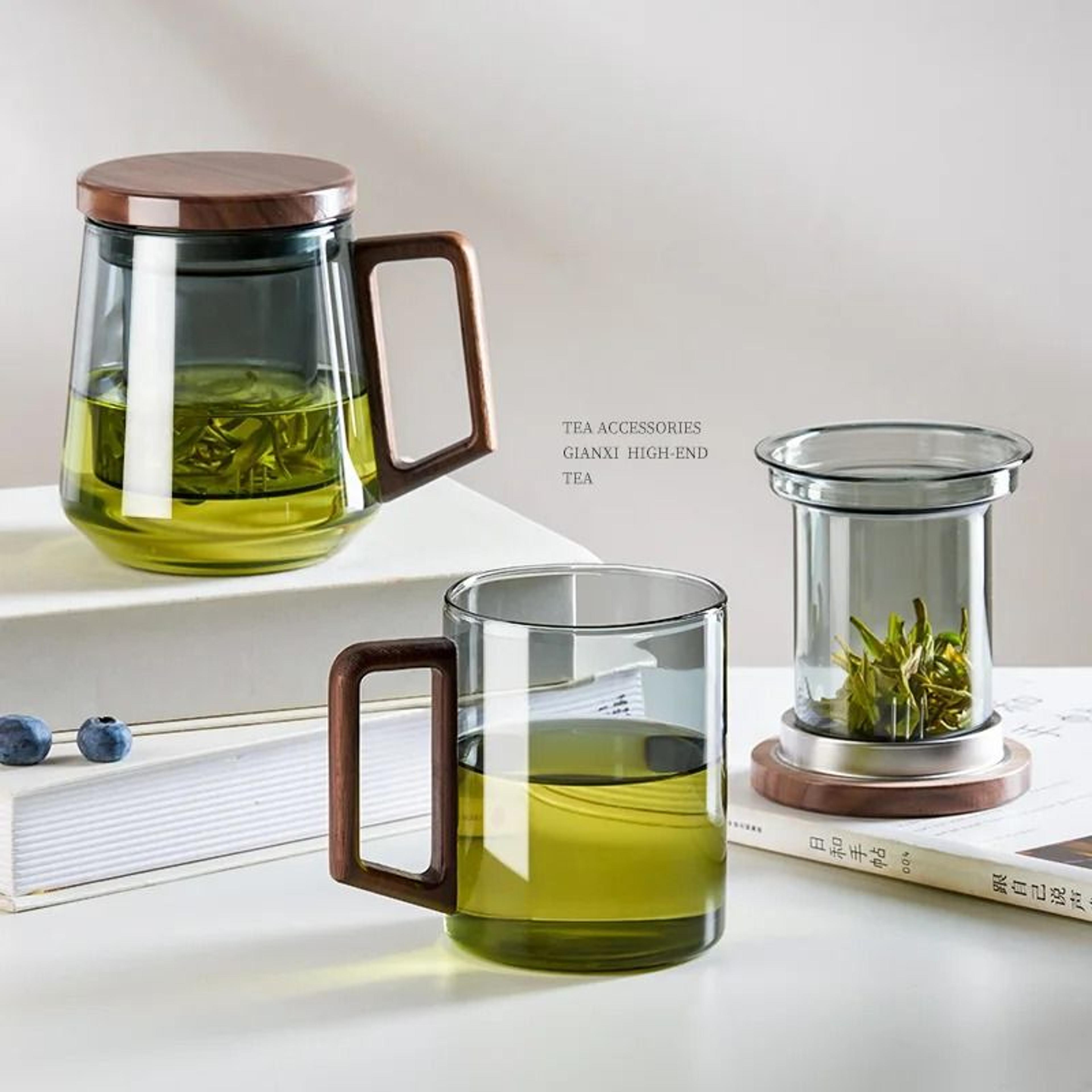 glass tea cup with wood handle and built-in filter for kung fu tea rituals