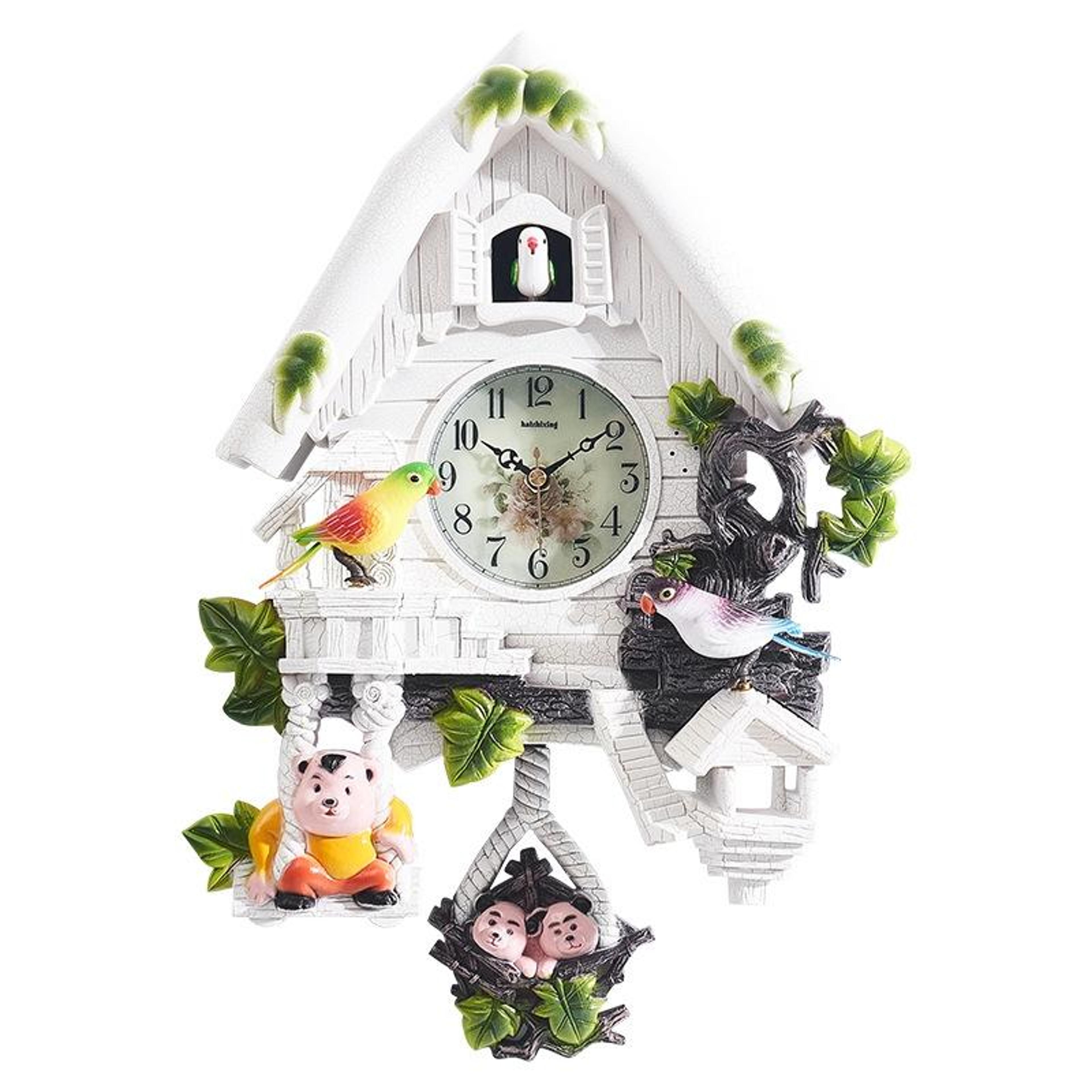 vintage cartoon cuckoo wall clock with singing birds and pendulum