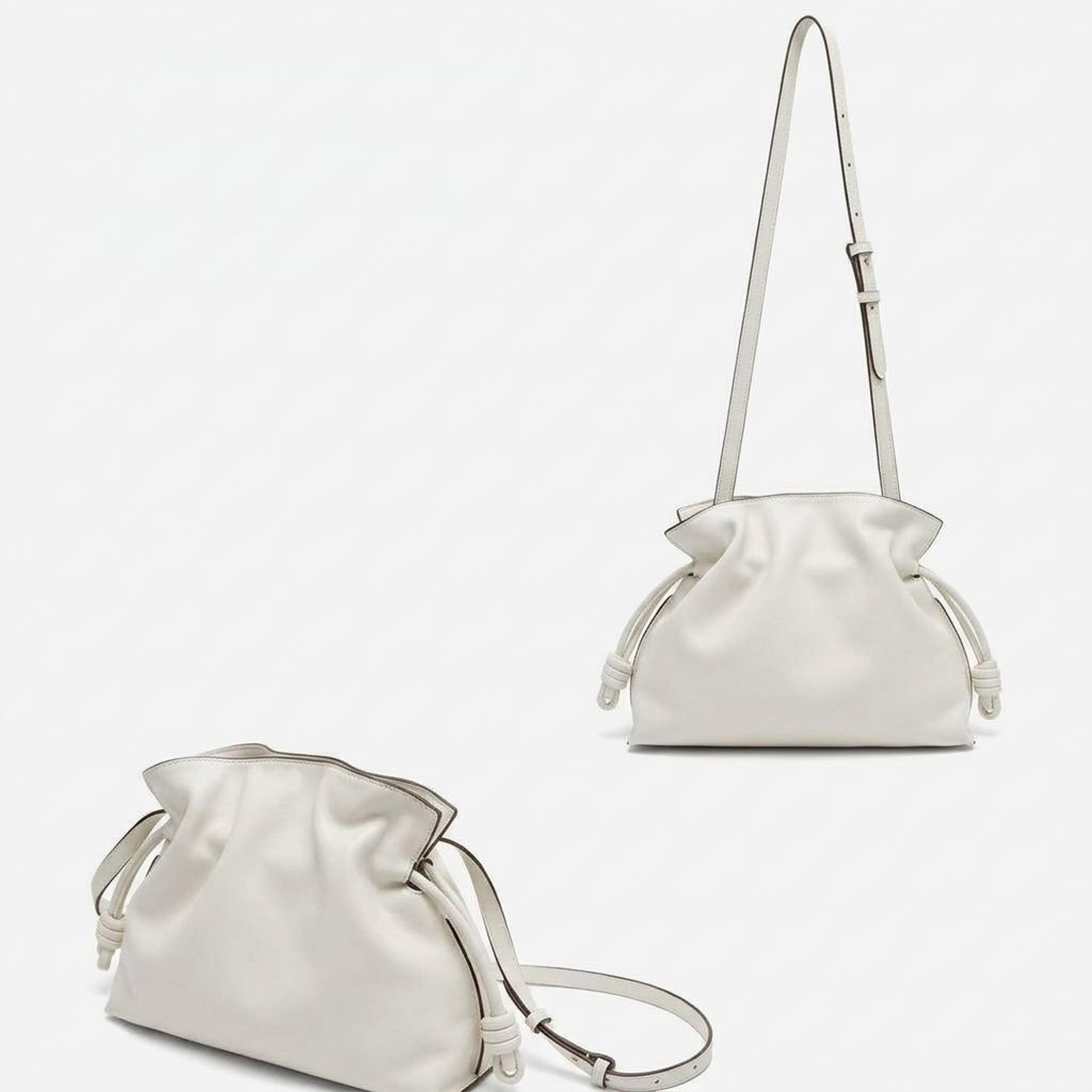 pleated shoulder bag with adjustable crossbody strap and zipper closure