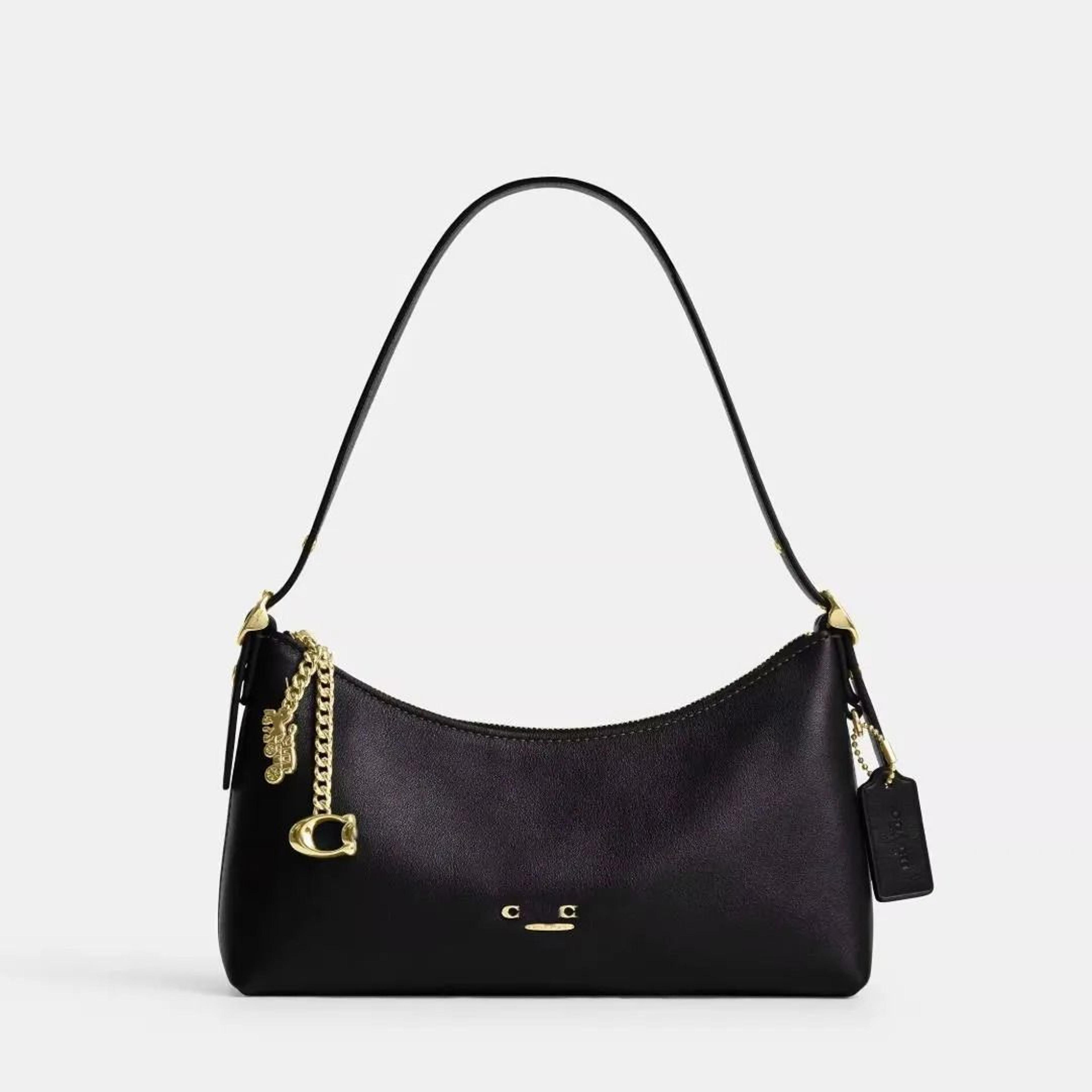 smooth leather underarm hobo bag with zipper closure and charm pendant