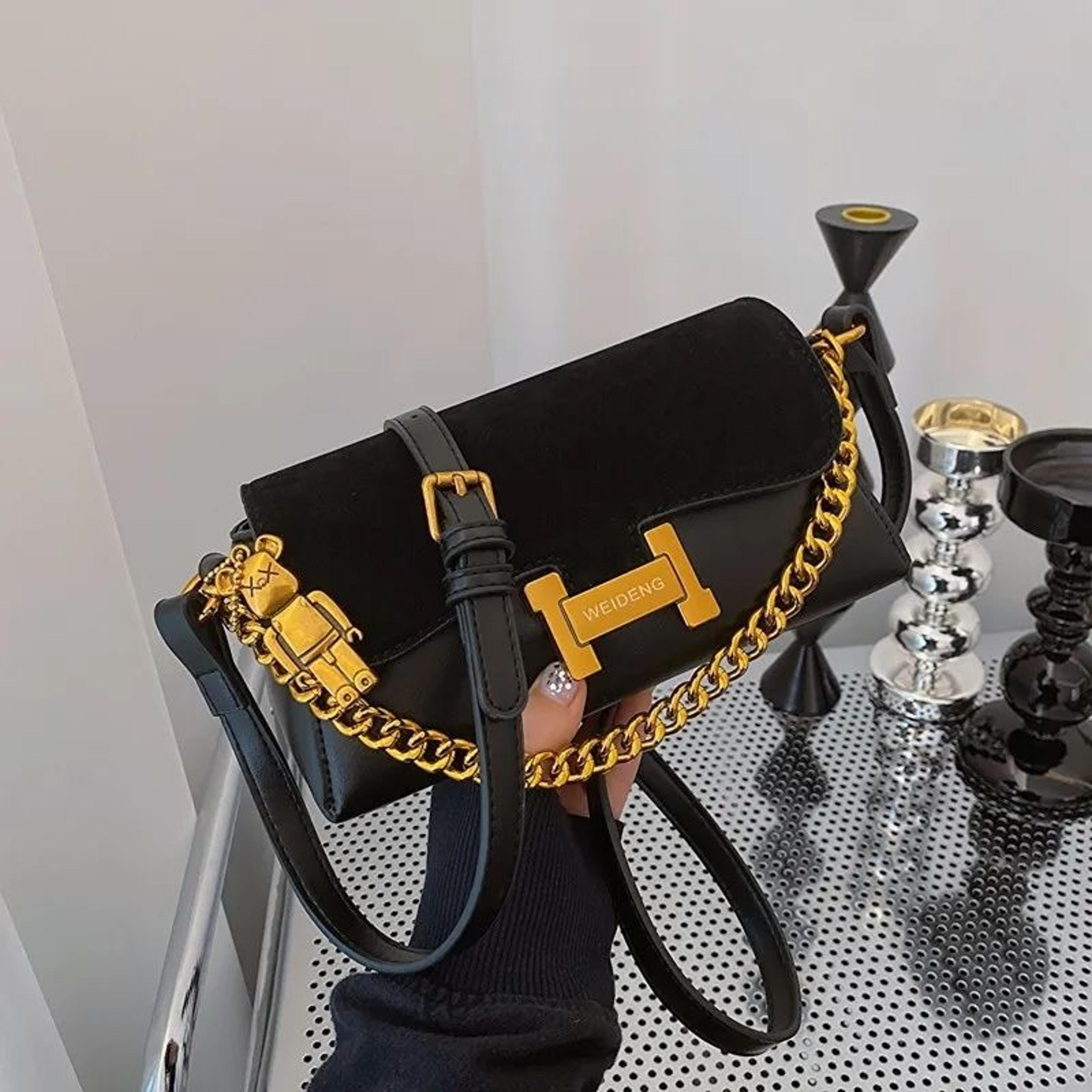 extra large black vegan leather crossbody bag with adjustable strap and bear charm