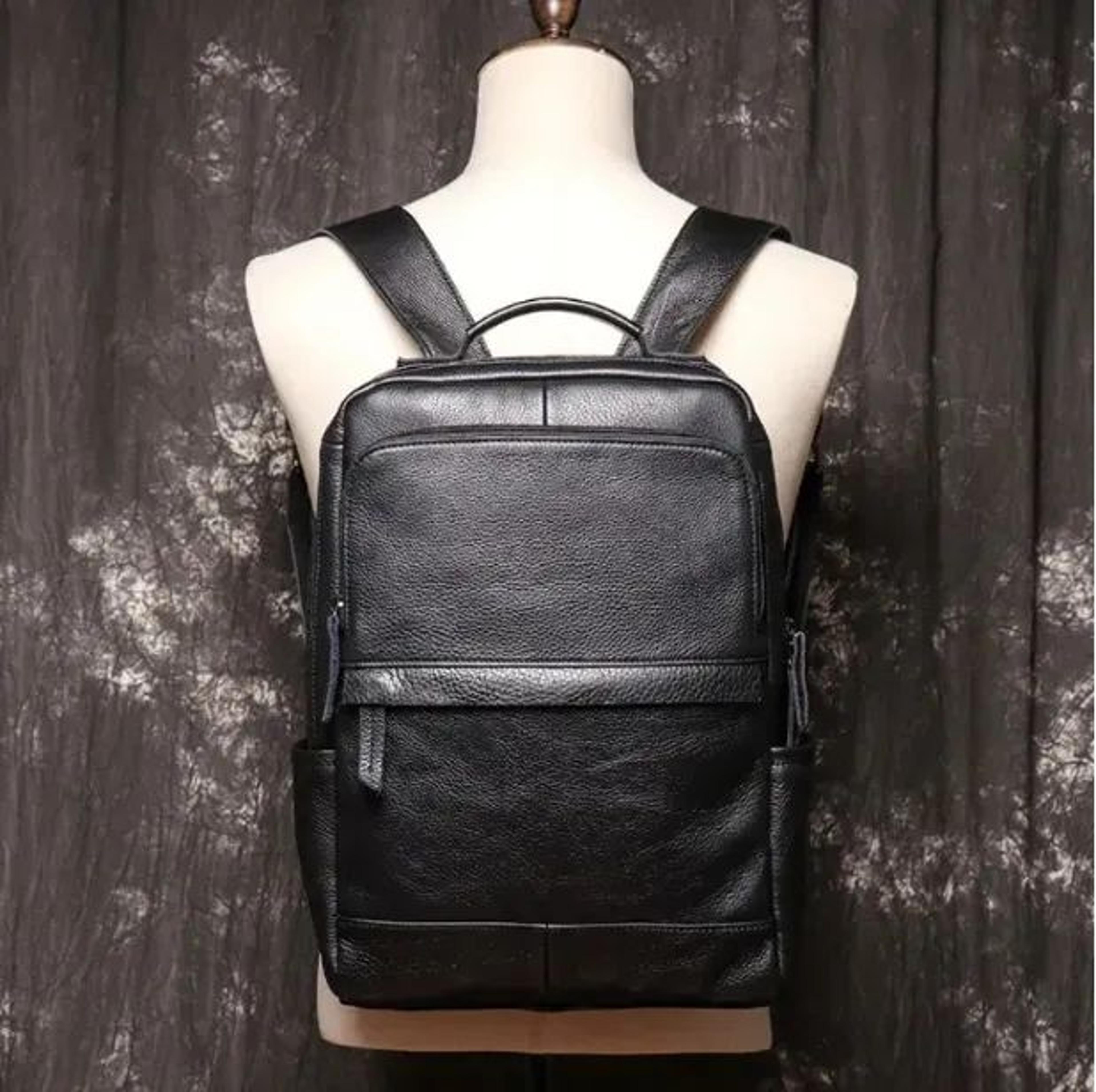 mens genuine leather backpack with large capacity laptop and travel storage