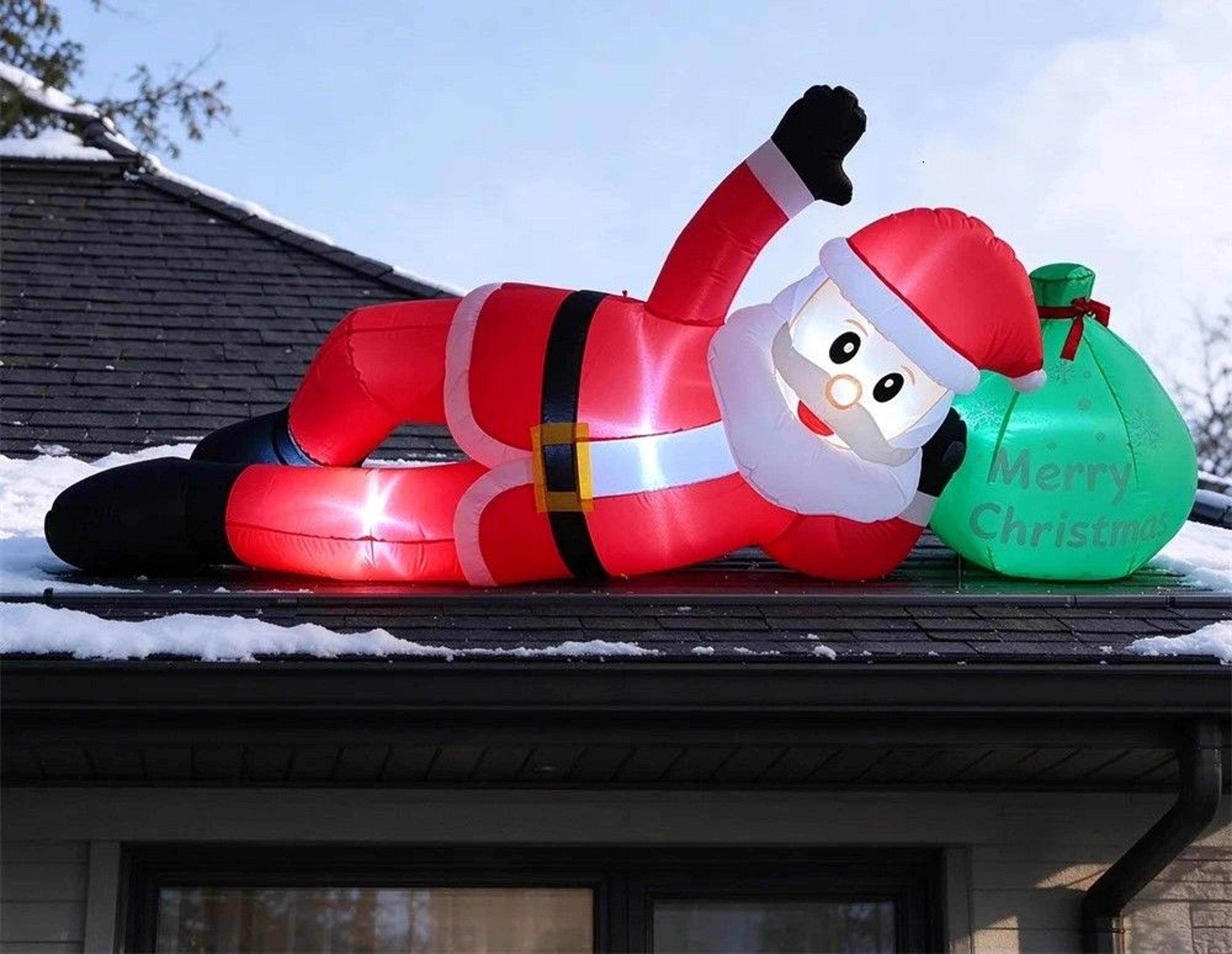 inflatable santa claus with gift bag and led lights for outdoor christmas decor
