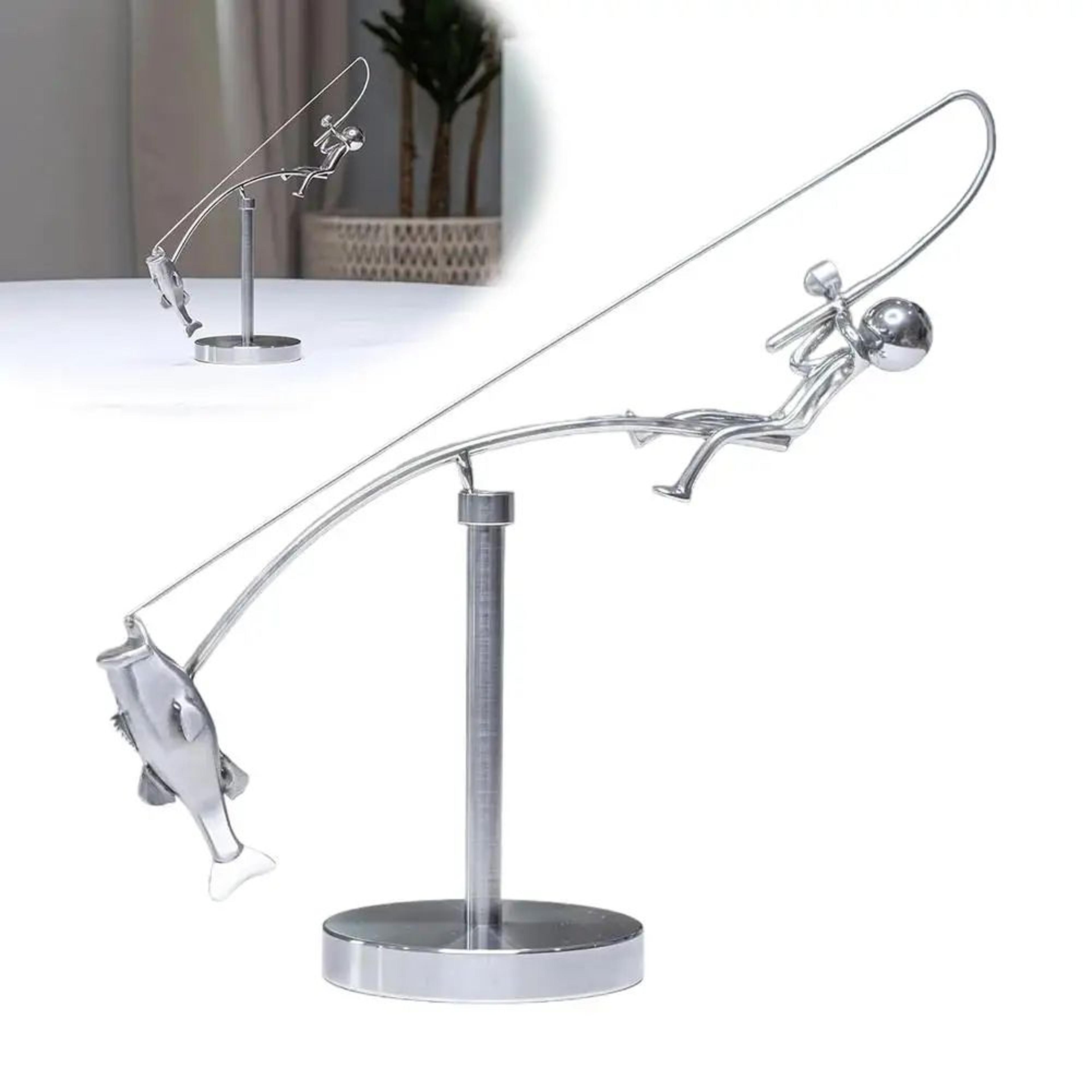polished stainless steel fisherman balancing sculpture