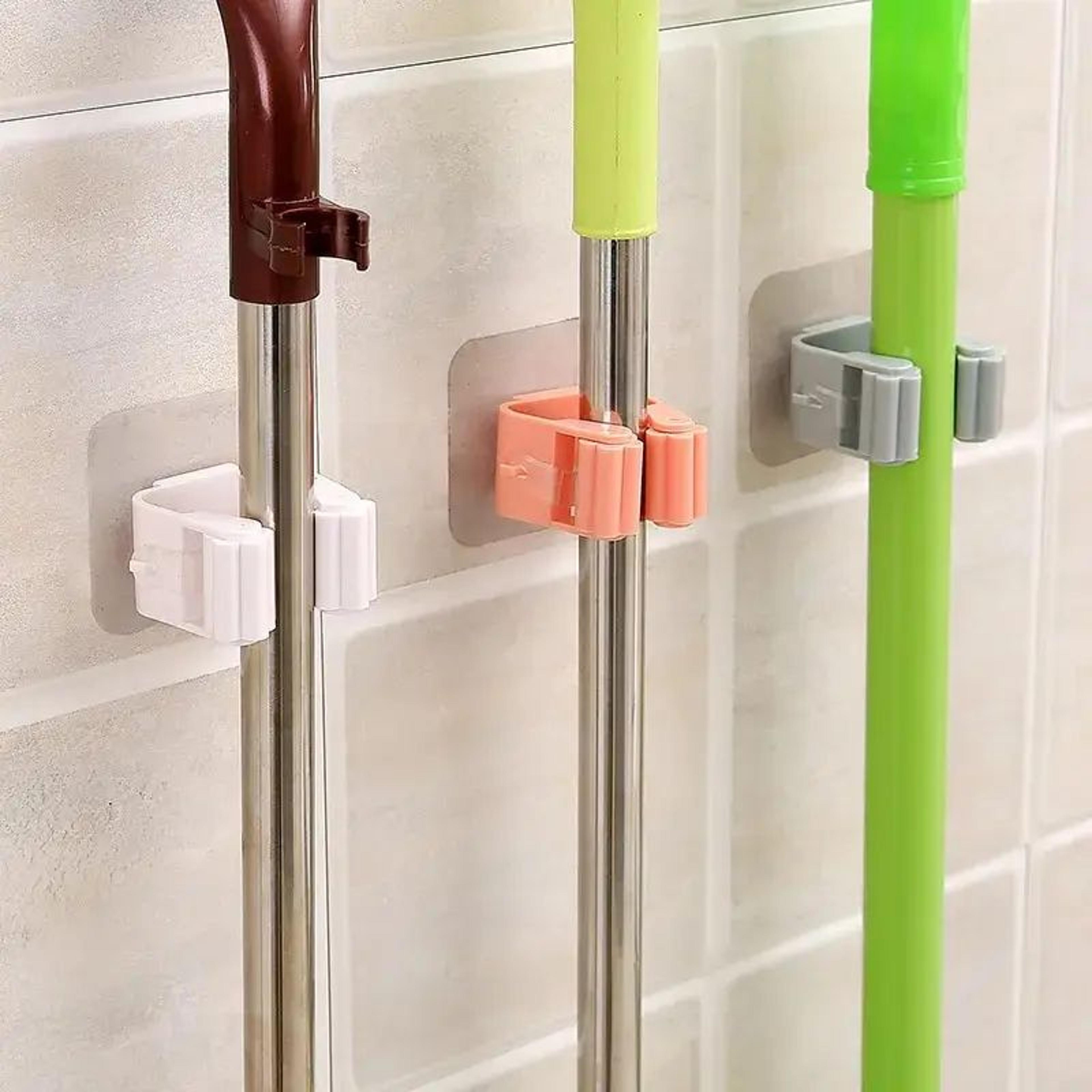 GripNest SelfAdhesive Wall Mounted Mop And Broom Holder 1