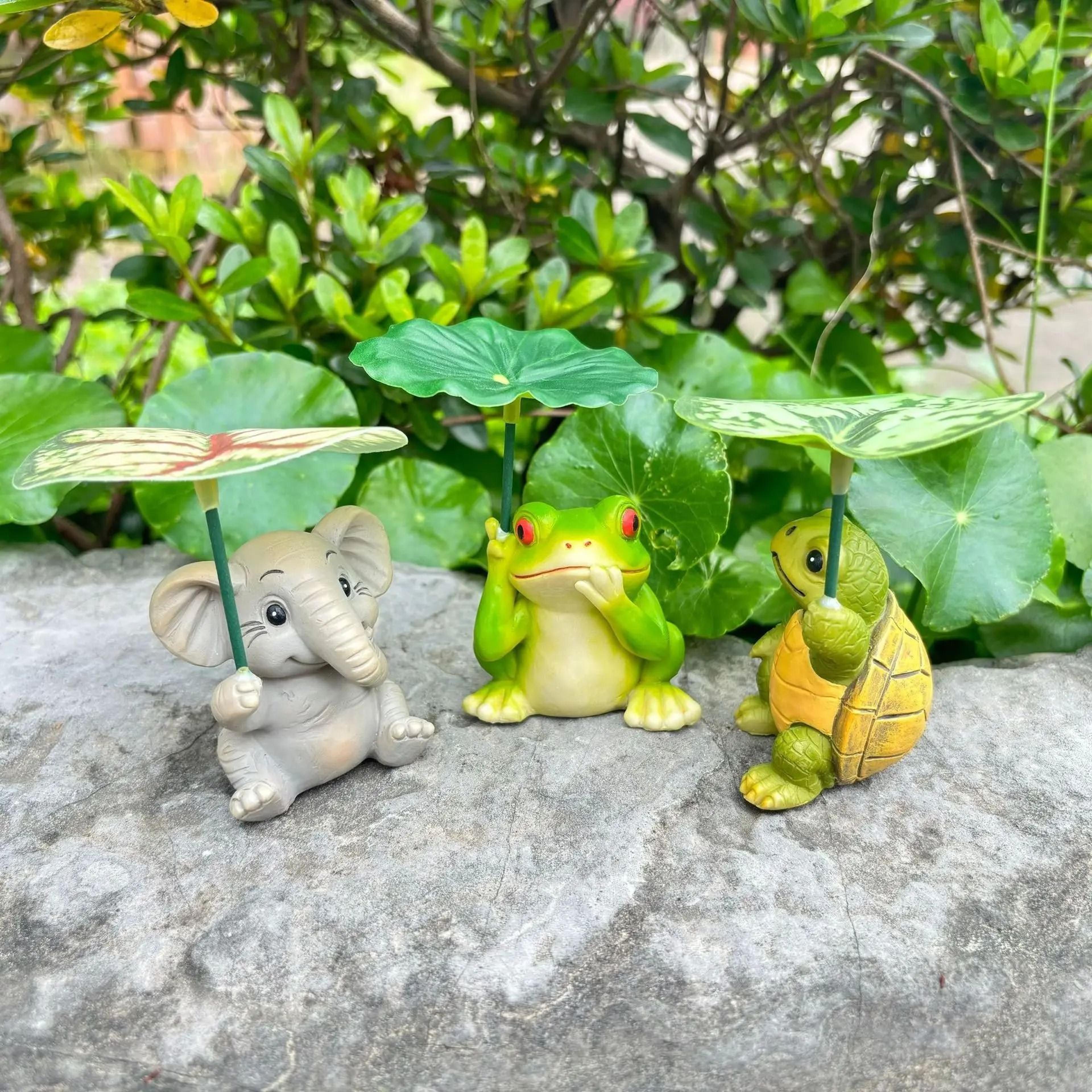 whimsical resin animal garden statue with leaf umbrella