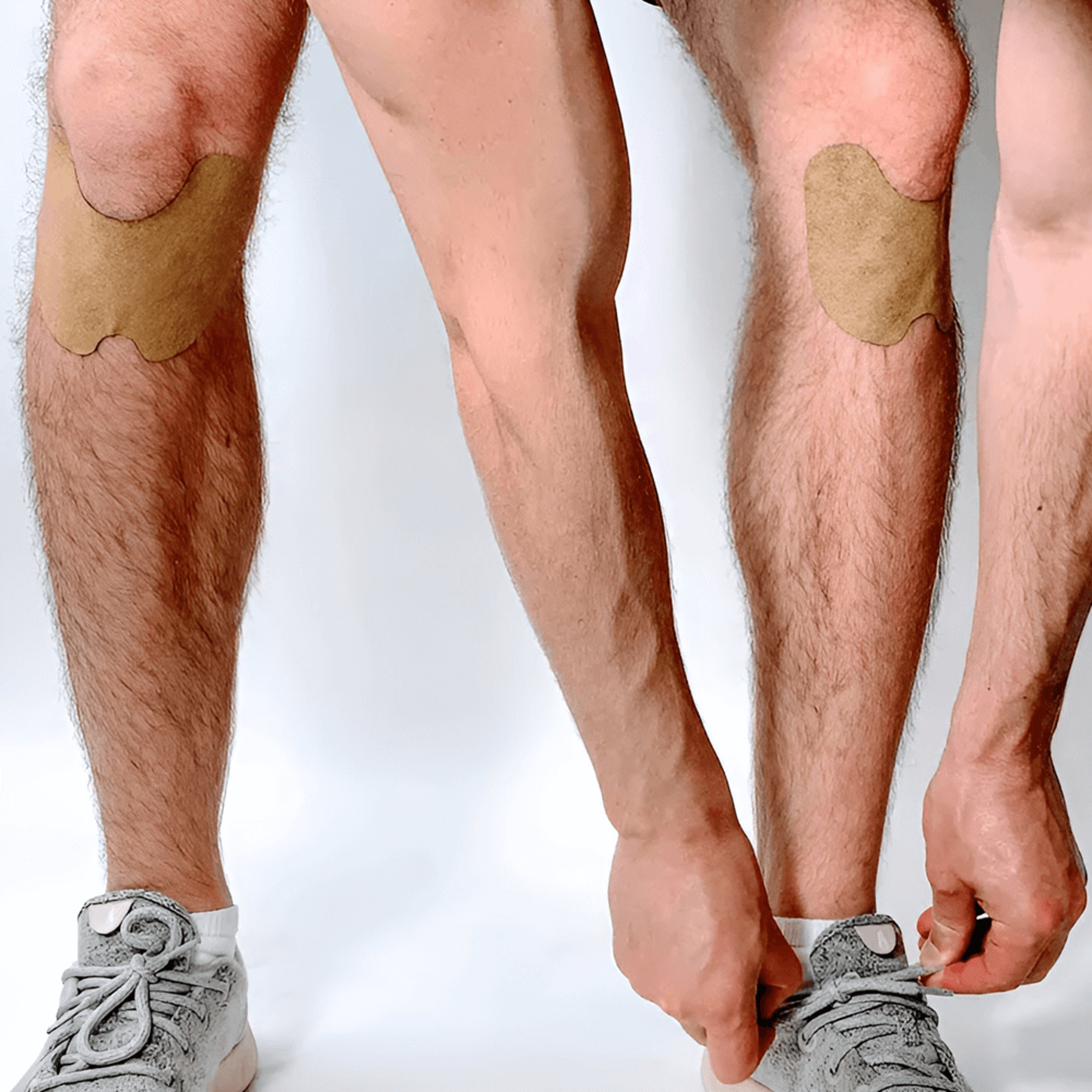 Herbal knee pain patches applied to a knee for relief