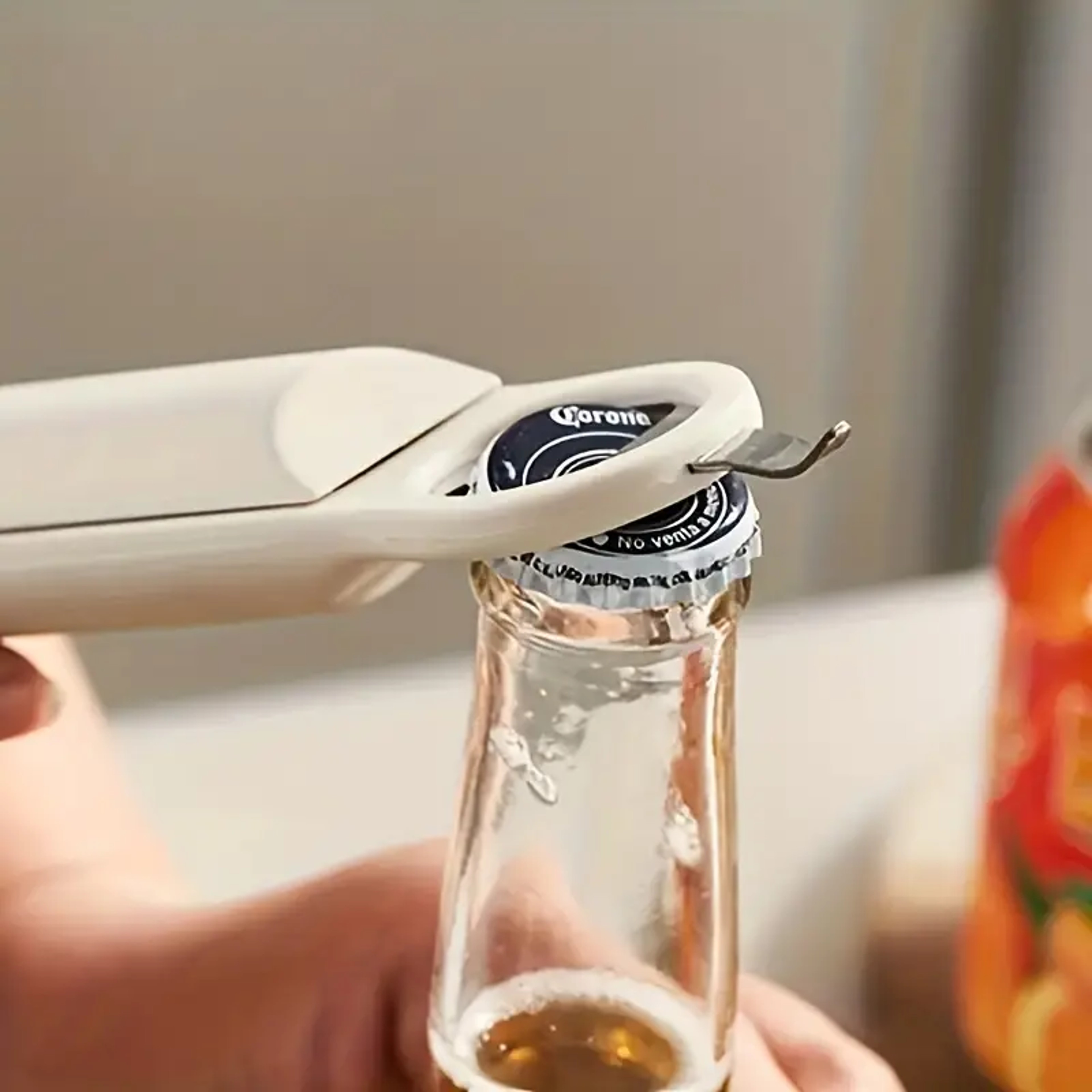 Effortlessly opening a beer bottle with adjustable retractable bottle opener