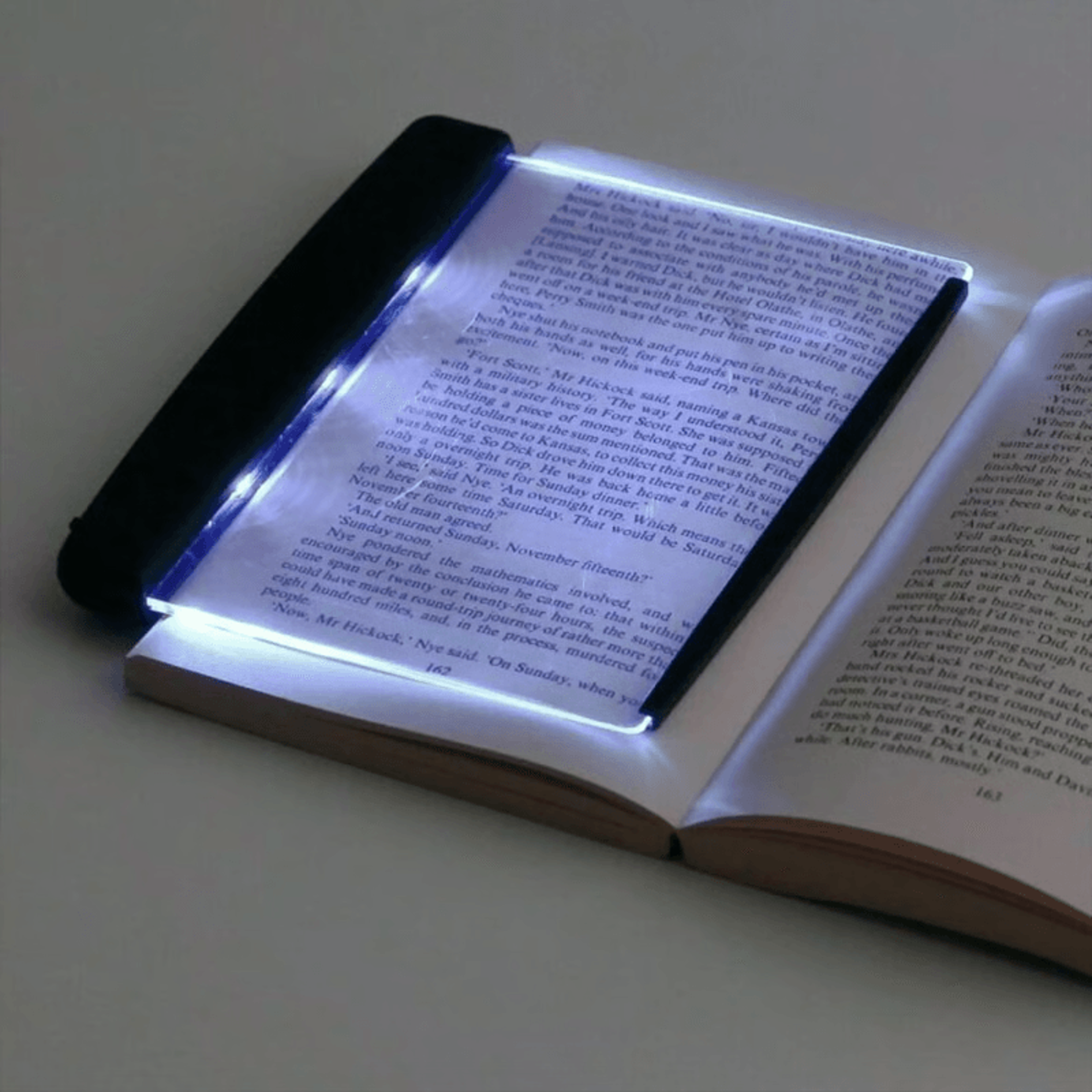 flat book light on novel for quiet night reading in bed