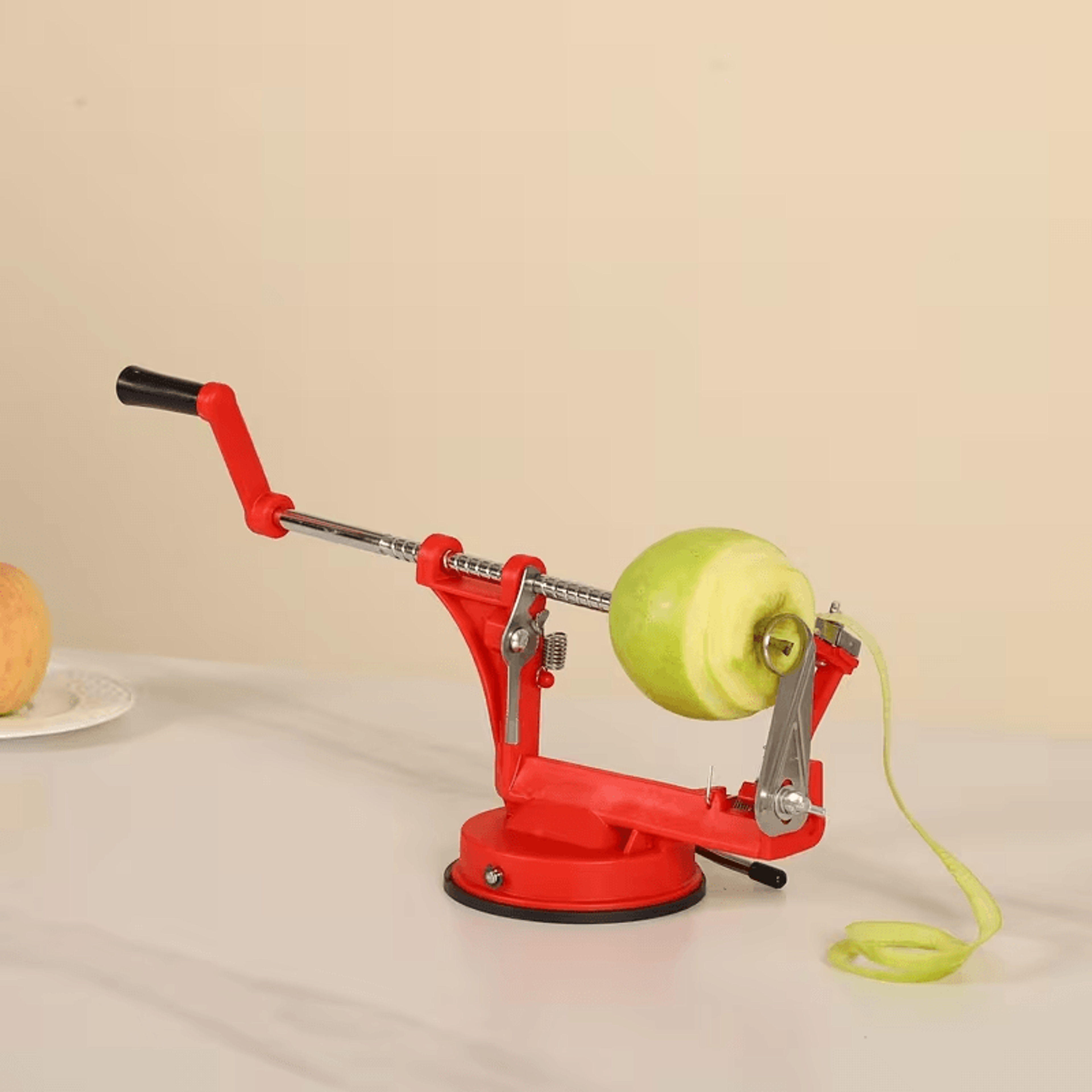 apple being peeled and sliced with hand crank tool