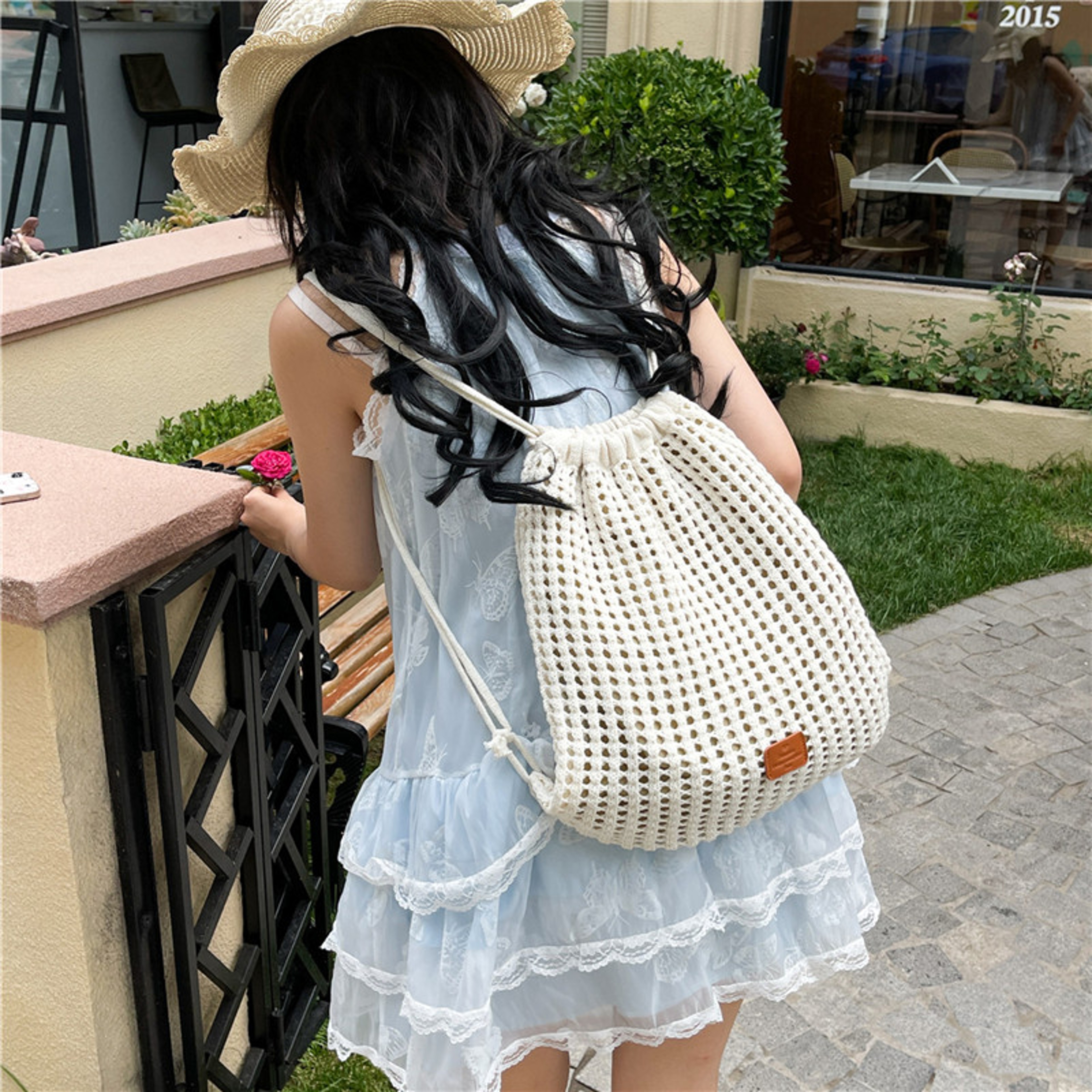 Trendy Woven Drawstring Bag – Large Capacity Hollow Design Boho Commuter Backpack for Shopping and Travel – view 1