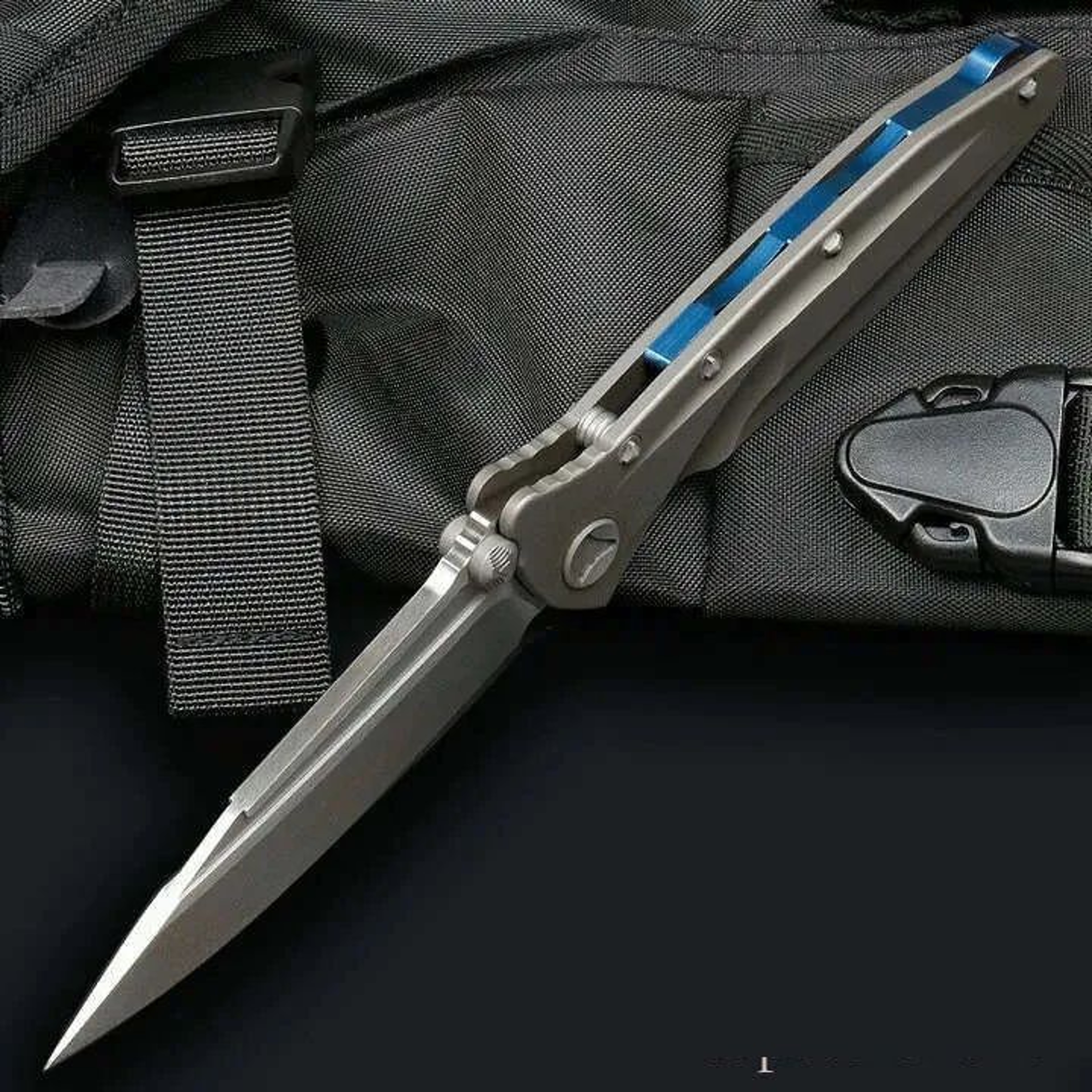 Drop Point Folding Pocket Knife With Titanium Handle And Ball Bearing Design 4