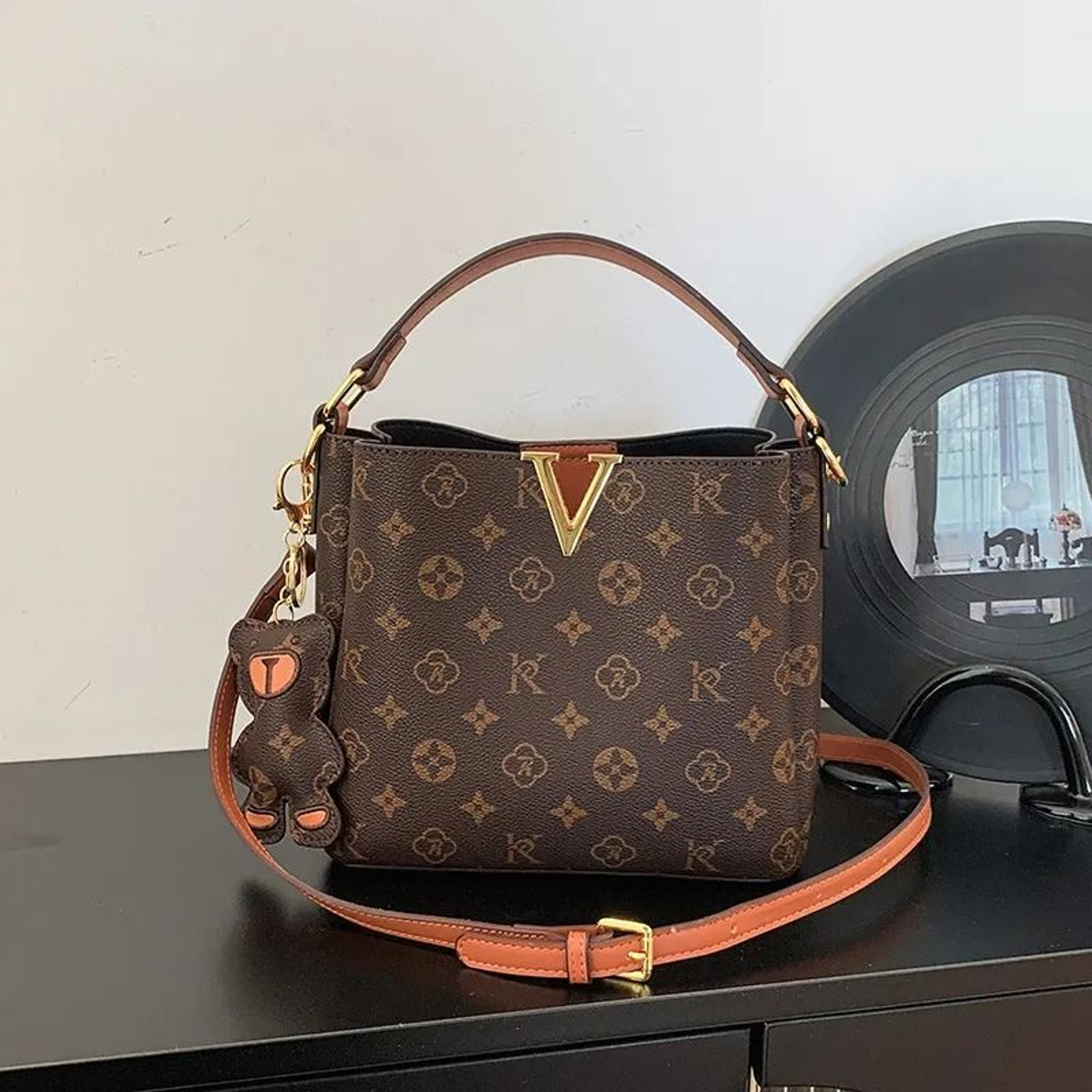 Women Circular Shoulder Bag With String Closure And Interior Zipper Pocket 1