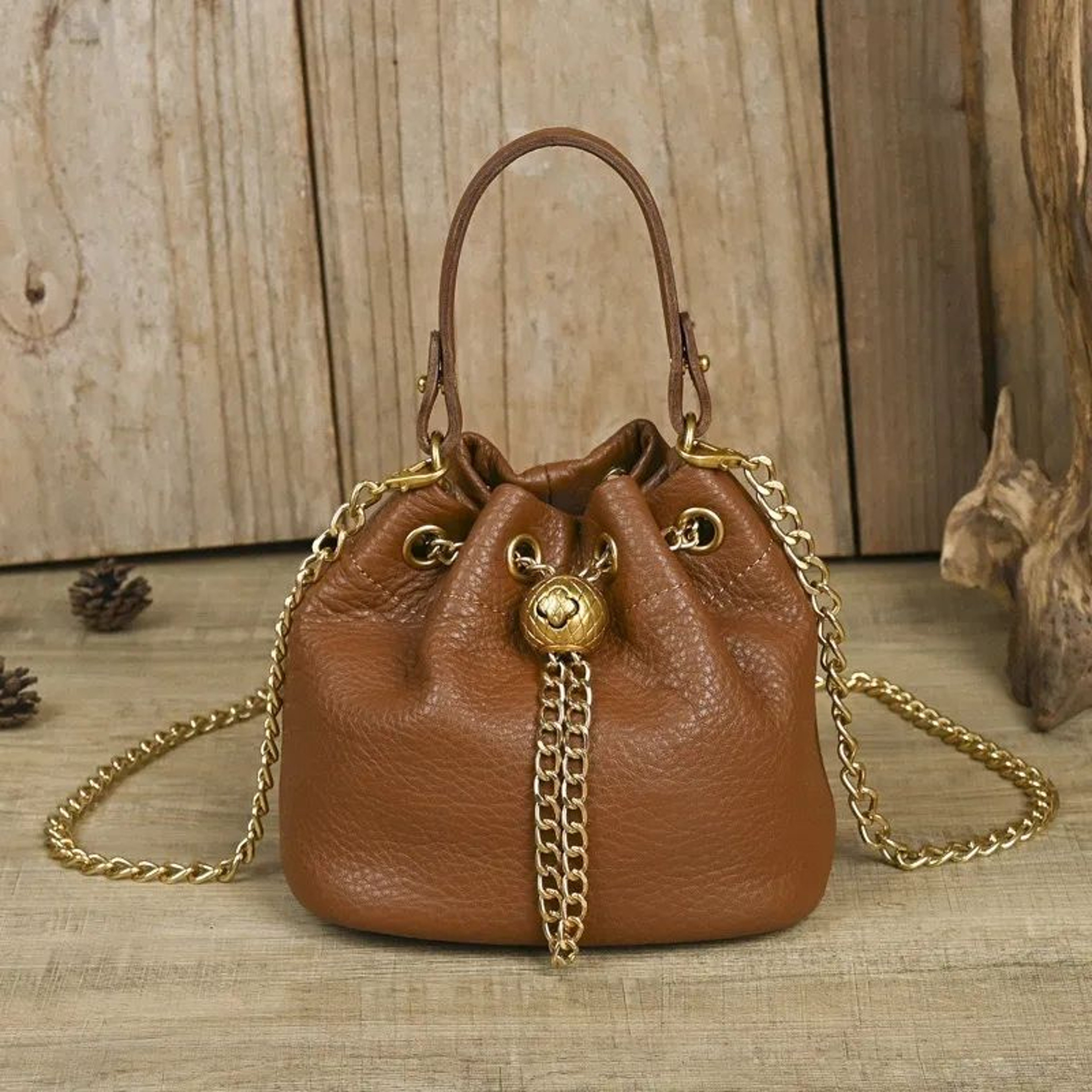 Women Soft Cowhide Bucket Bag With Adjustable Chain Strap And Gold Ball Accent 1