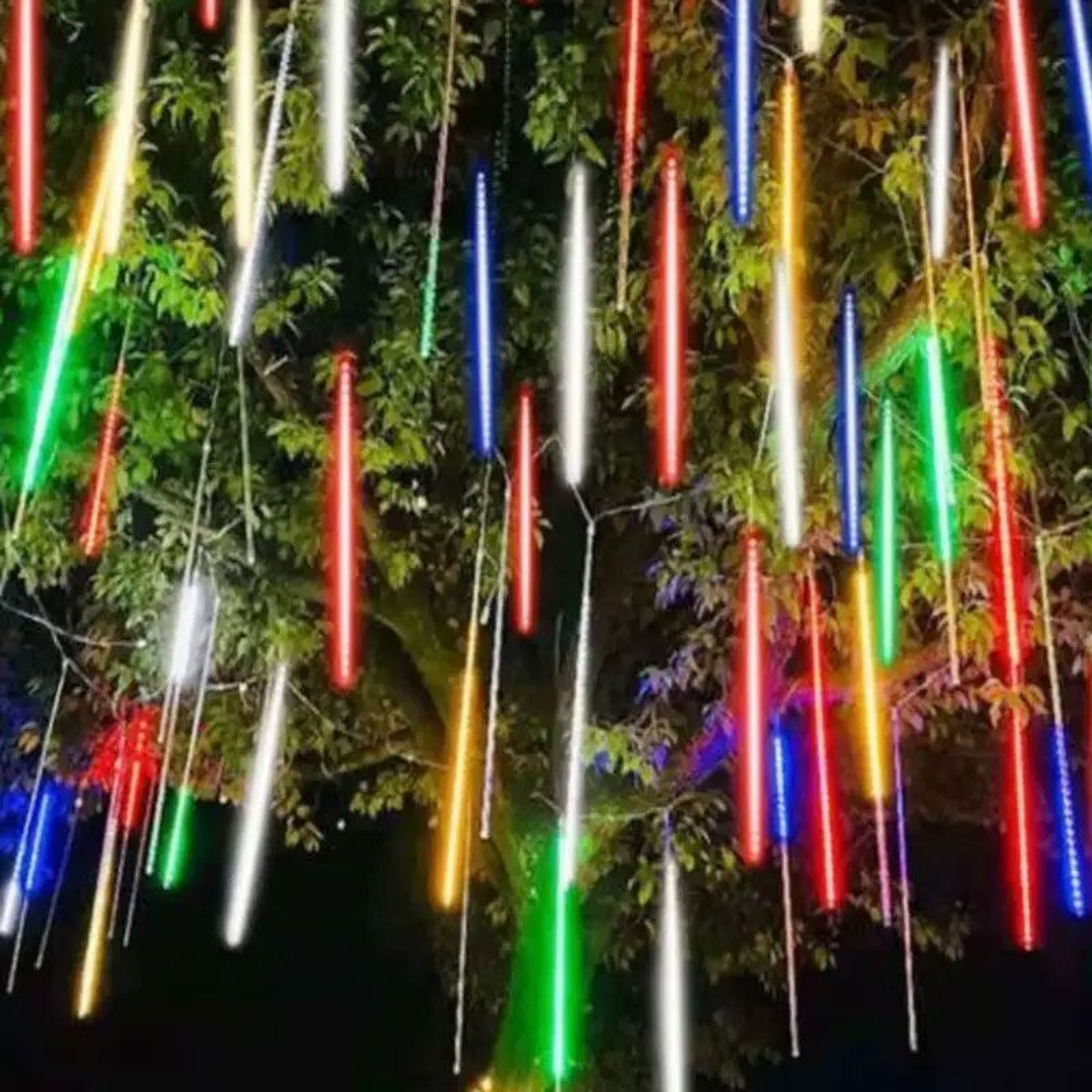 Dripping icicle lights glowing in the snow