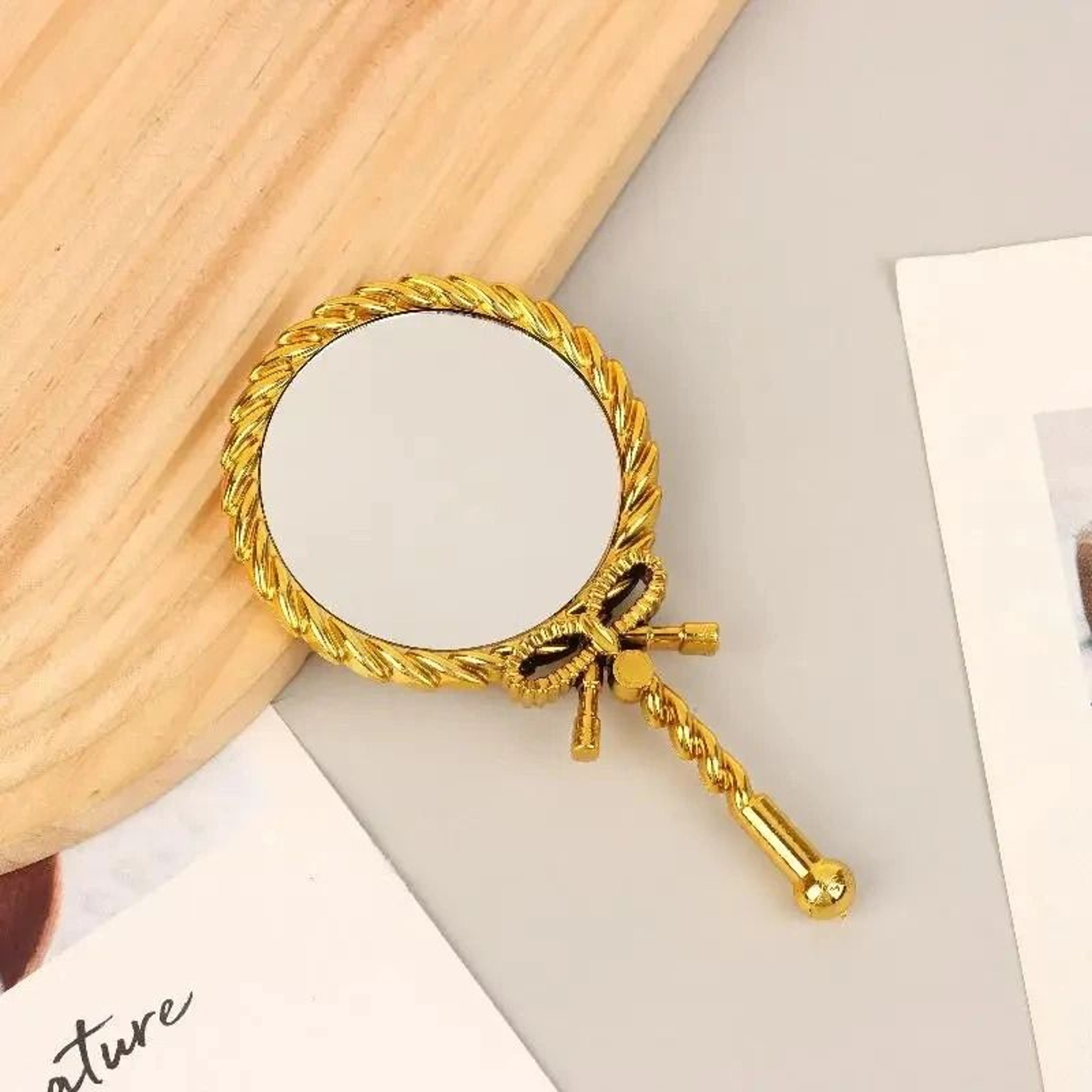 Elegant Round Handheld Makeup Mirror For Portable Beauty And Grooming Use 2