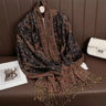 Versatile pashmina wrap styled over dress