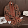 Woman wearing pashmina shawl in winter