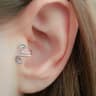 Woman wearing acupressure earrings for natural weight loss