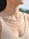 Gold beaded layered necklace with iridescent star crystals
