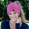 women wearing ponytail beanie on winter walk