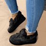 Woman walking on icy path in fleecelined winter cotton shoes